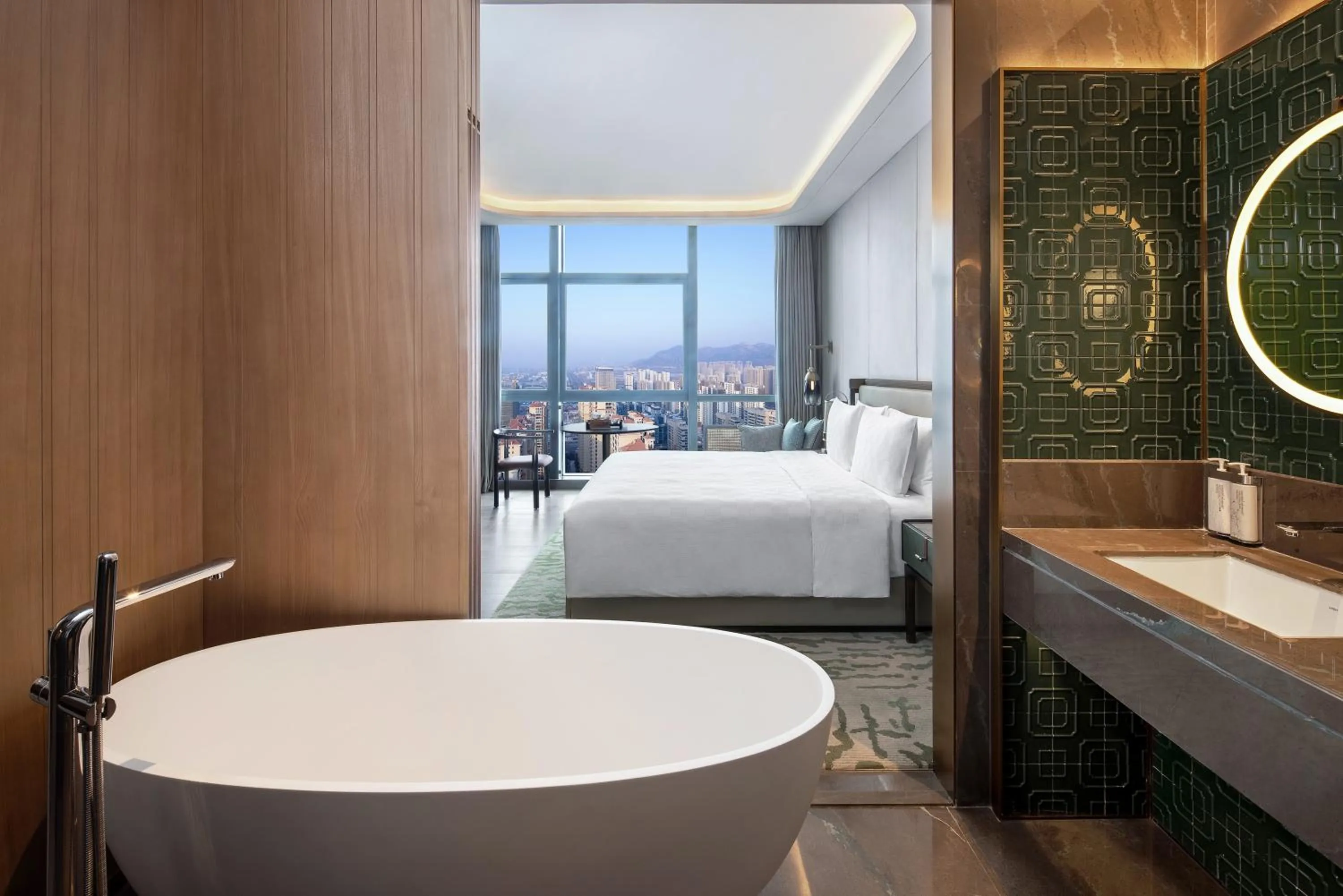 Bed in HUALUXE Hotels and Resorts Qingdao Licang, an IHG Hotel