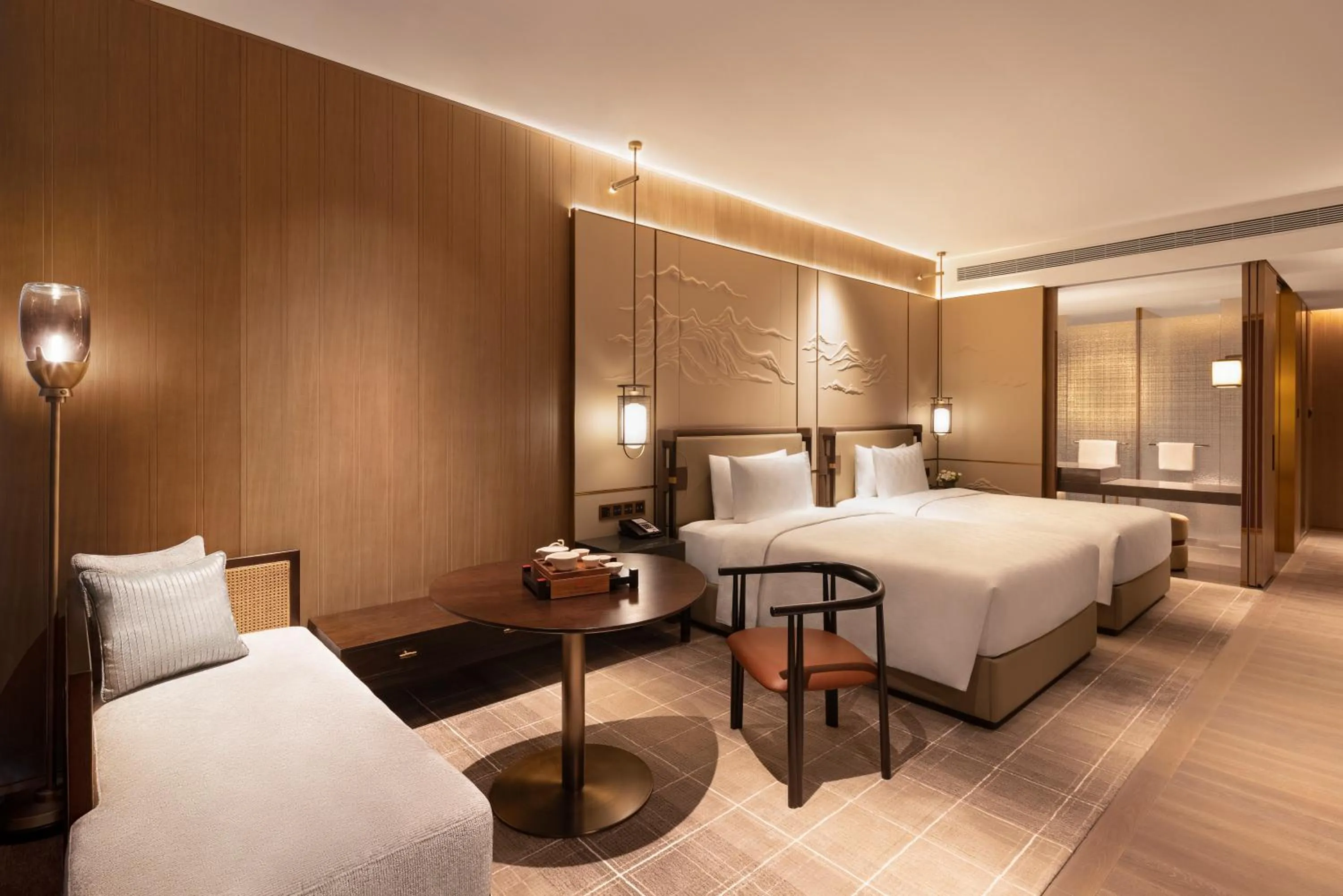 Bed in HUALUXE Hotels and Resorts Qingdao Licang, an IHG Hotel