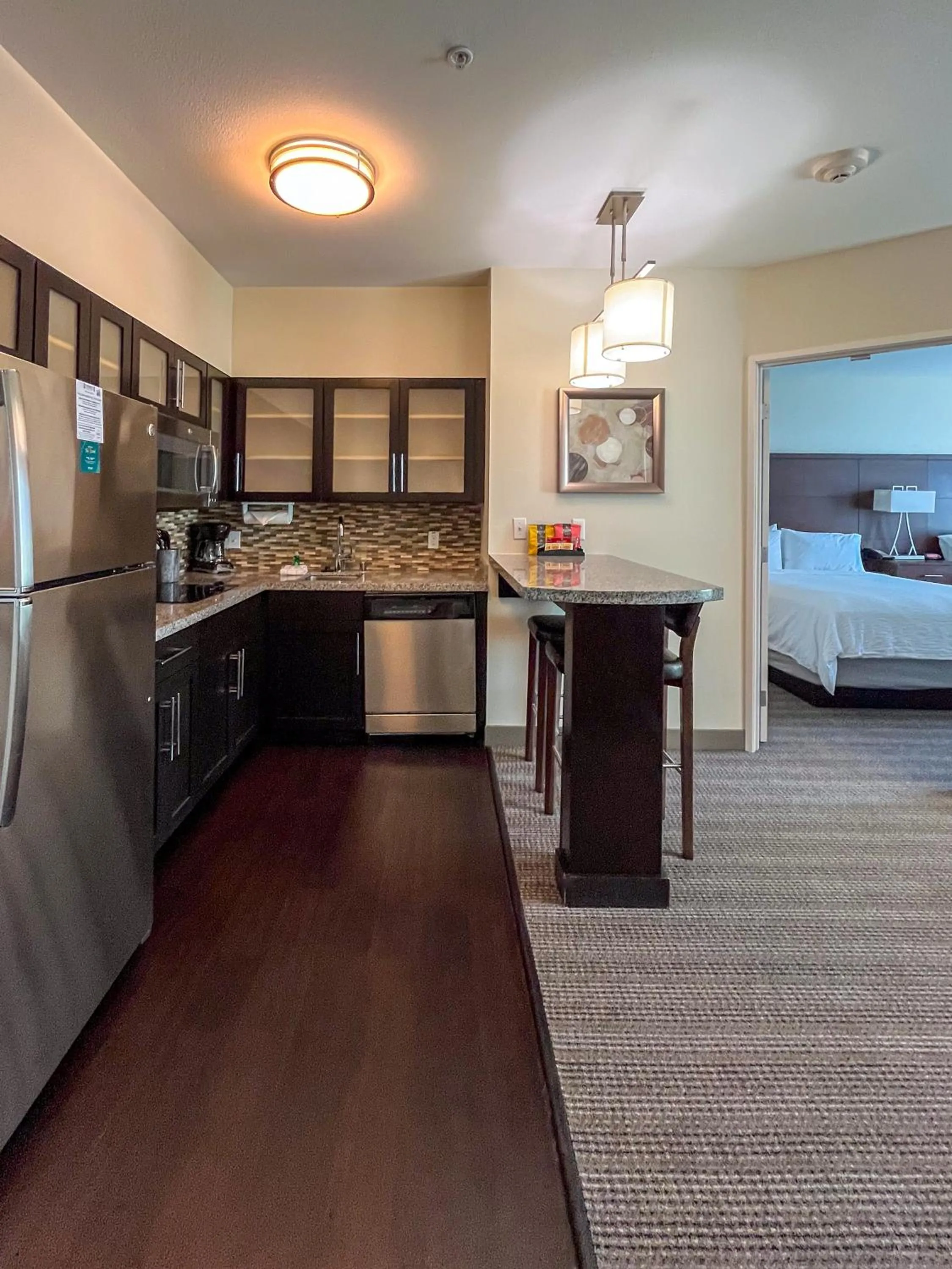 Kitchen or kitchenette, Bed in Staybridge Suites Carlsbad/San Diego by IHG