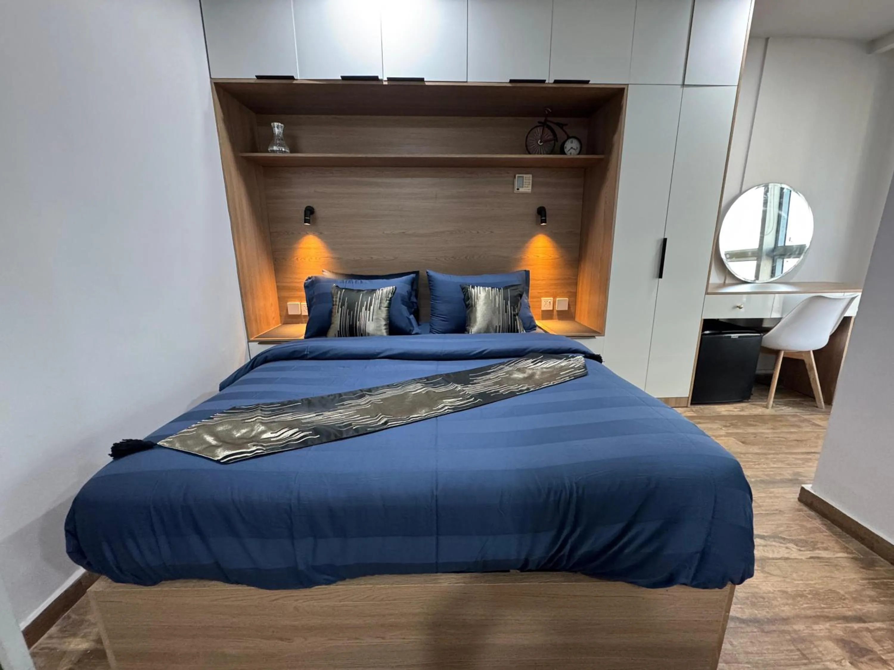 Photo of the whole room, Bed in The Centaurus Apartments