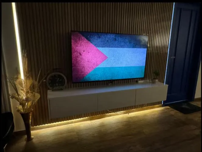 Communal lounge/ TV room in The Centaurus Apartments