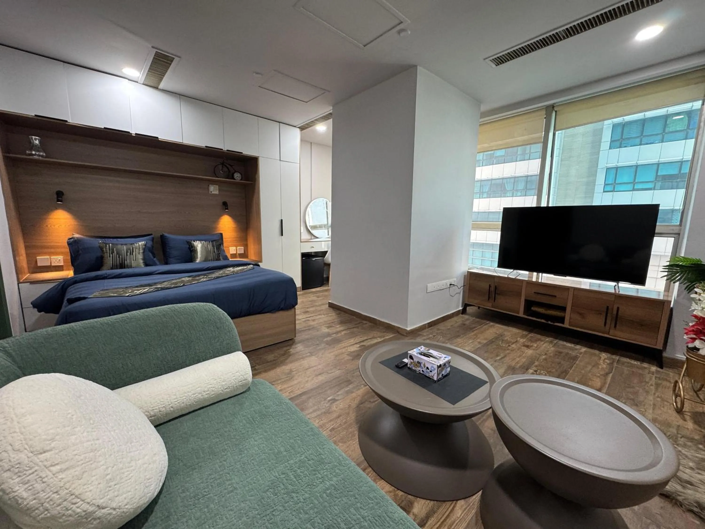 Living room, Bed in The Centaurus Apartments