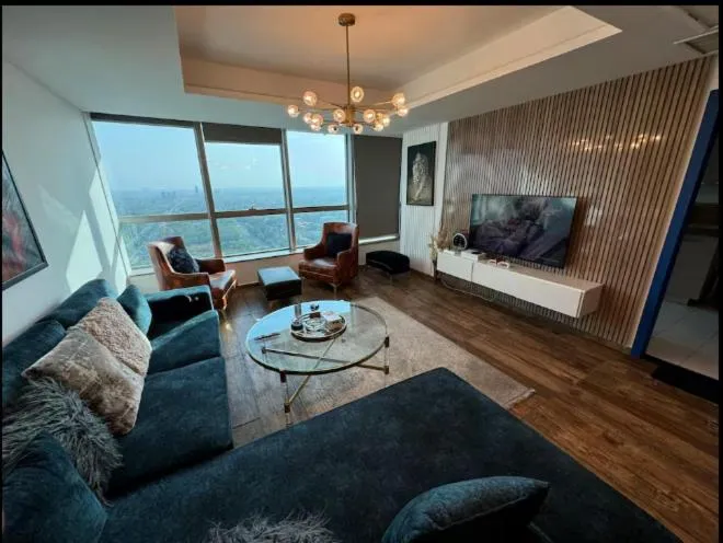 Communal lounge/ TV room in The Centaurus Apartments