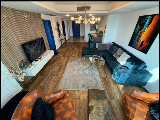 Communal lounge/ TV room in The Centaurus Apartments