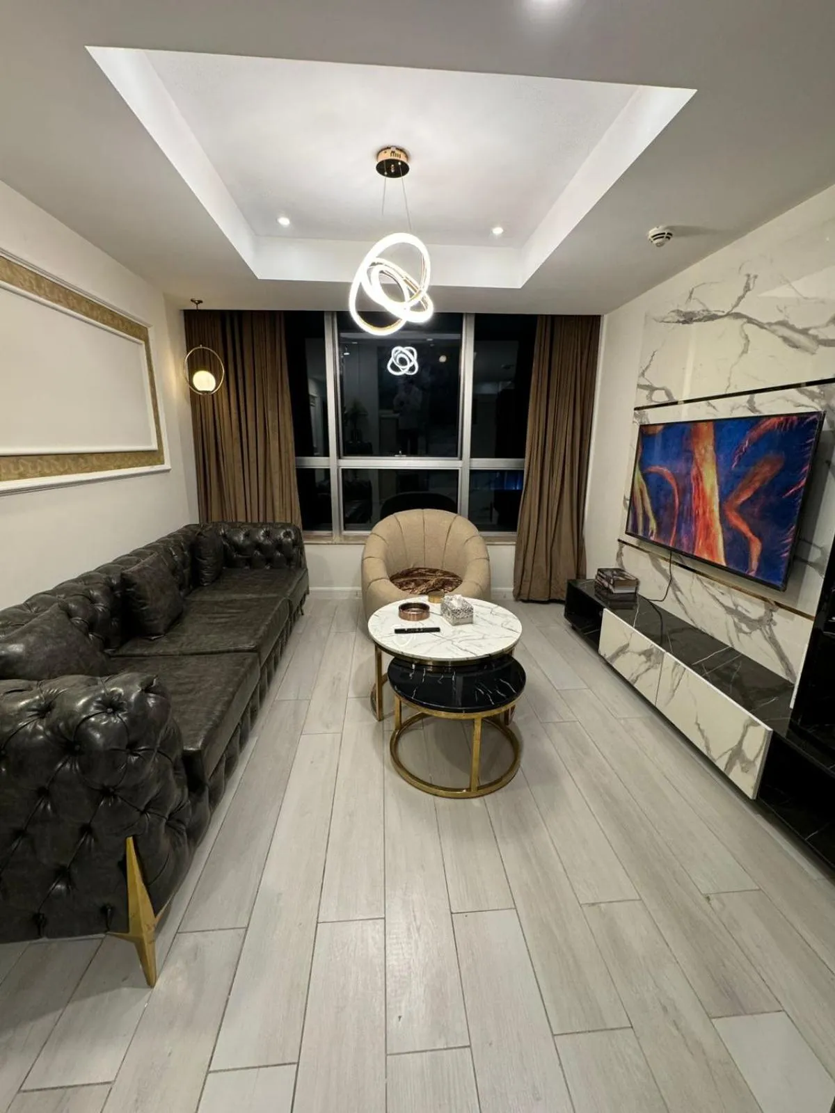 Communal lounge/ TV room in The Centaurus Apartments