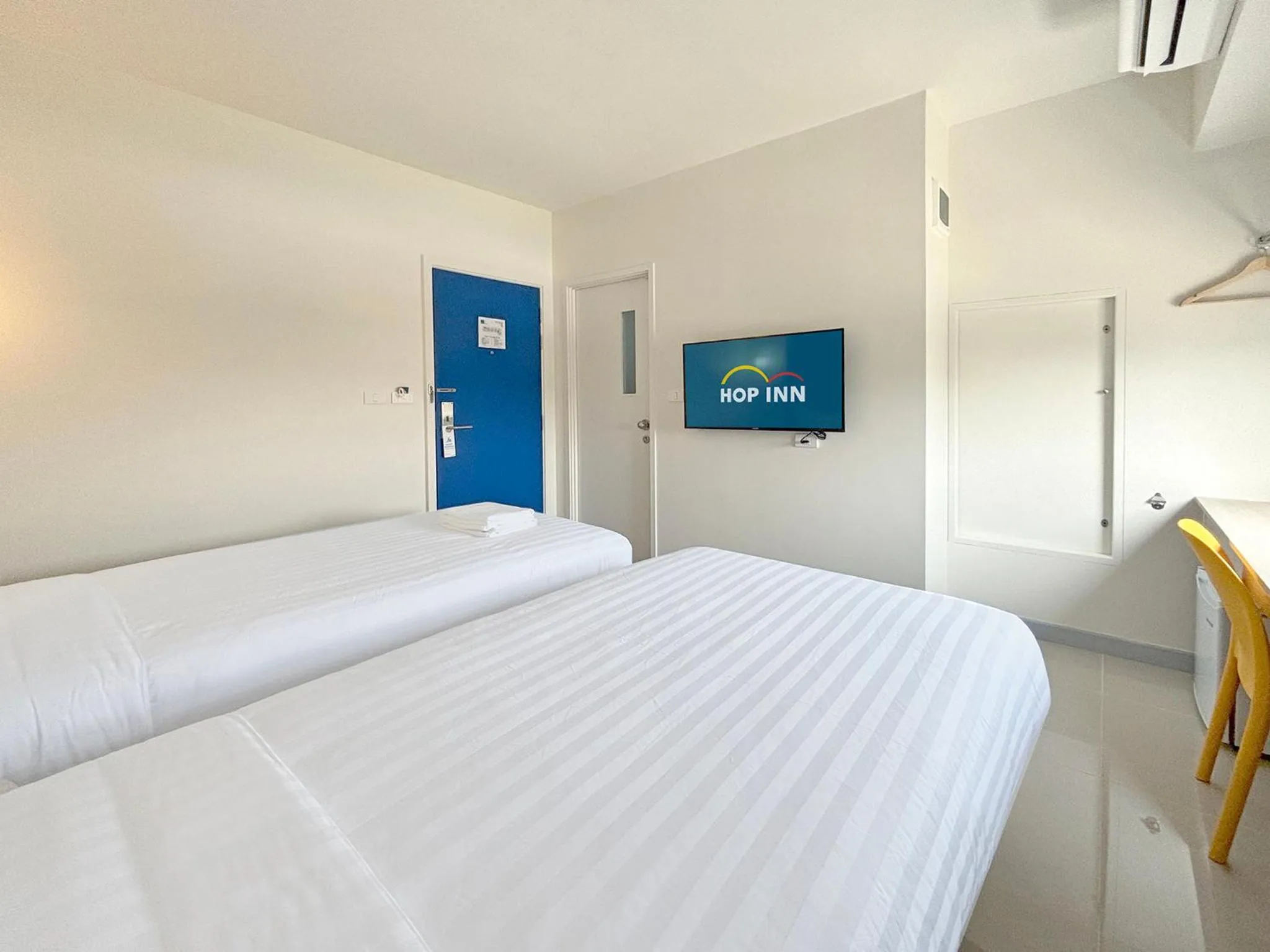 Bed in HOP INN Suphanburi