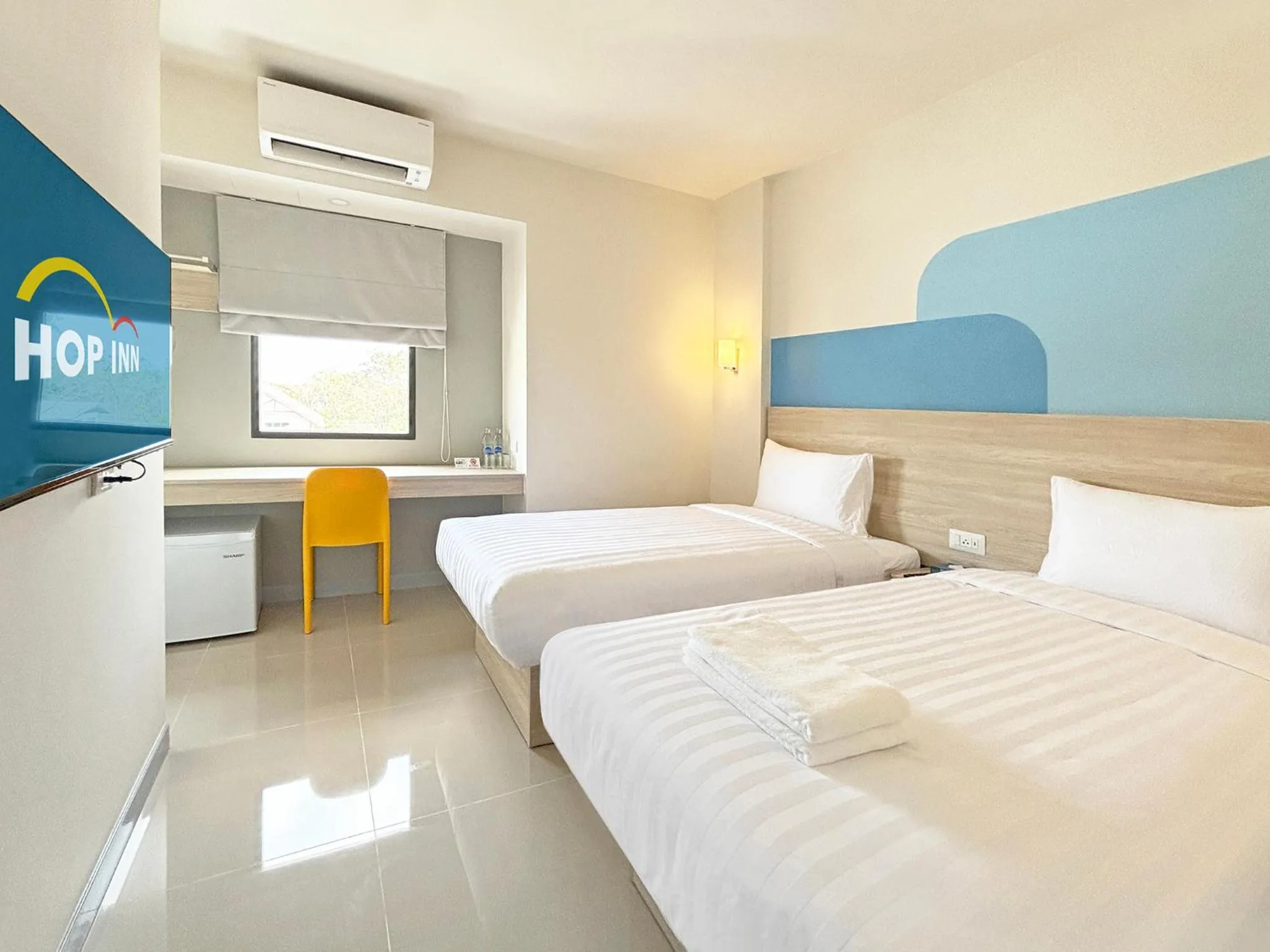 Bed in HOP INN Suphanburi