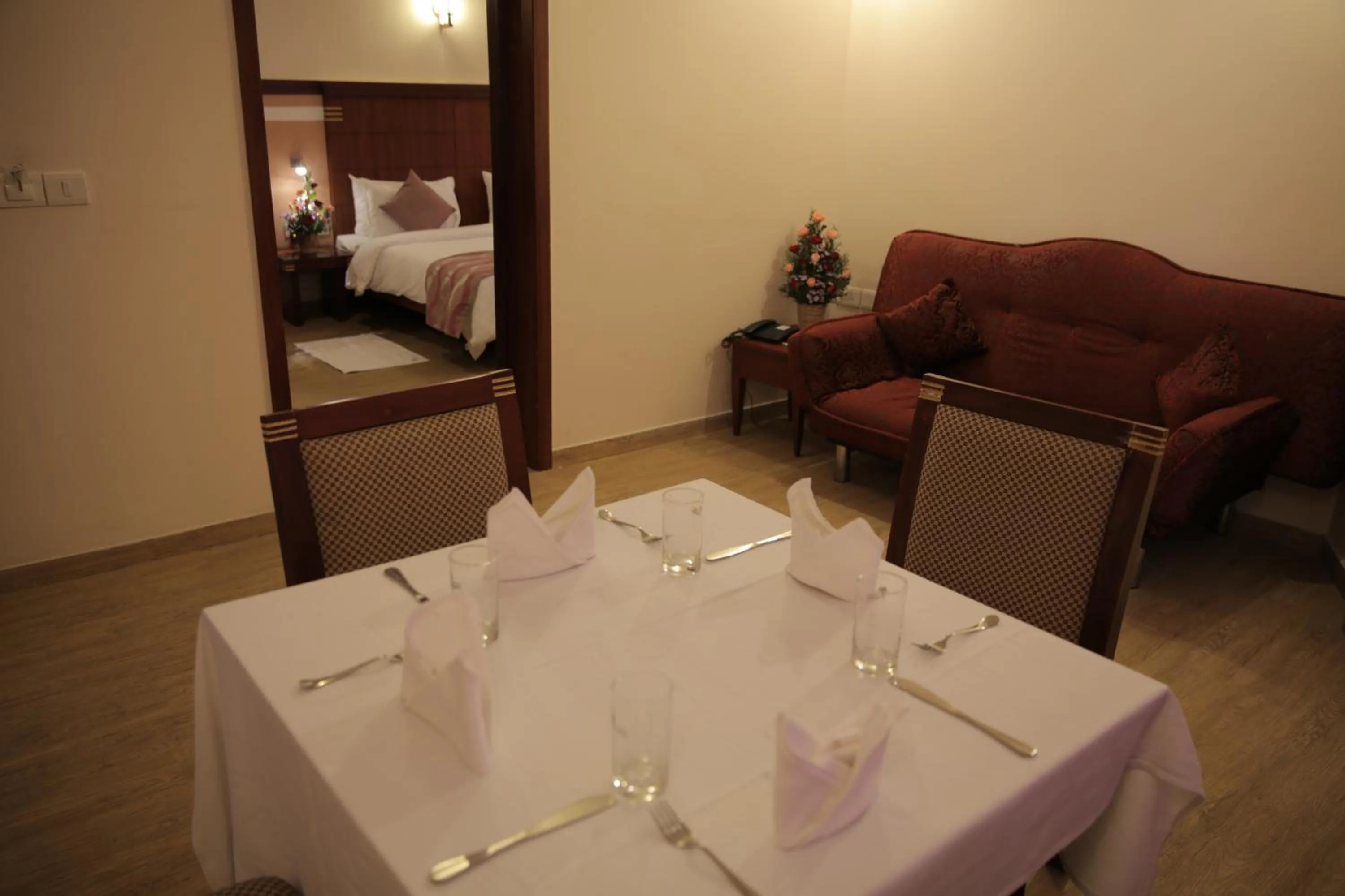 Living room, Bed in KTDC Rain Drops Hotel