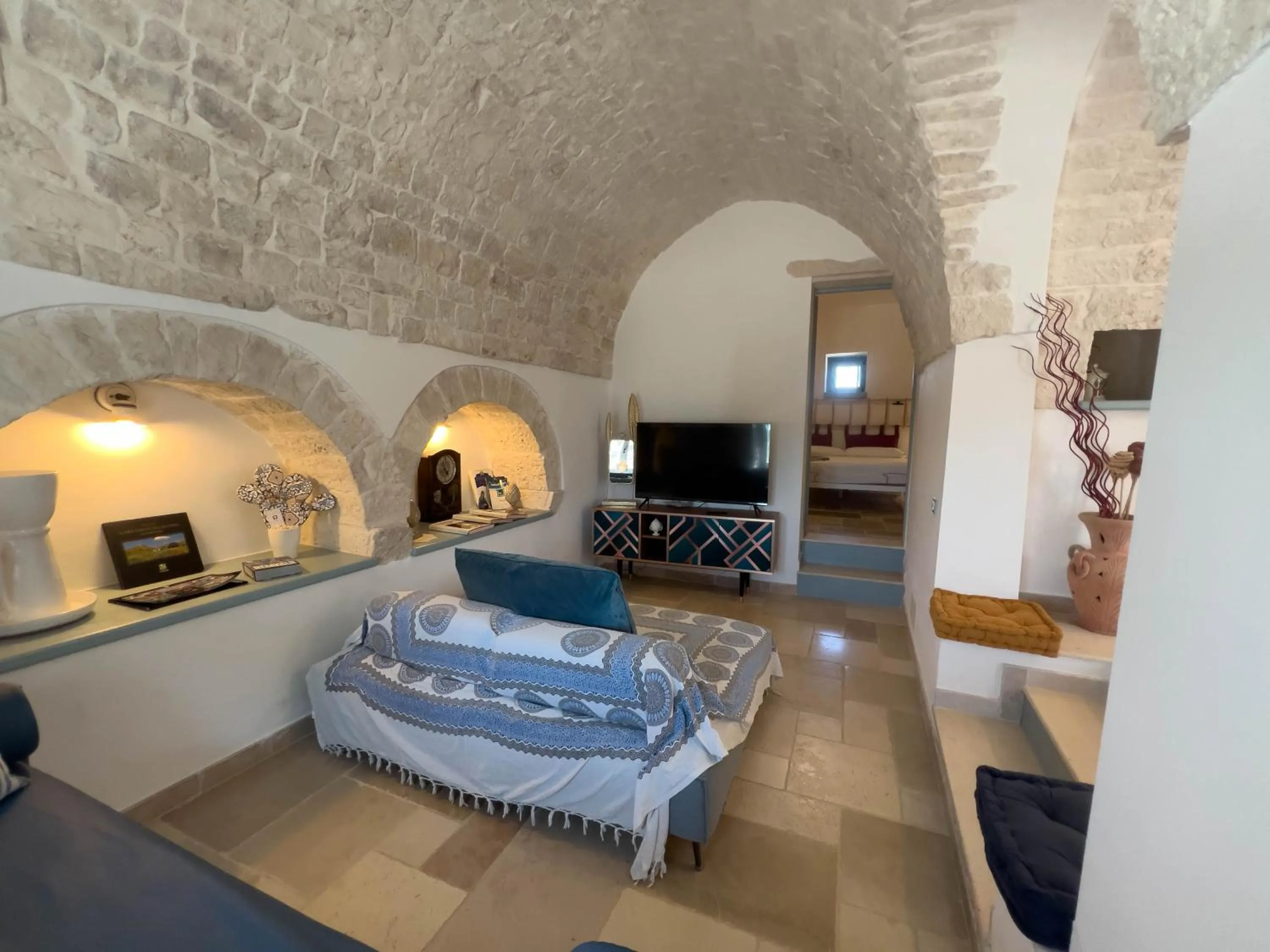 Communal lounge/ TV room, Bed in Trullo Dimora Podere Papilio