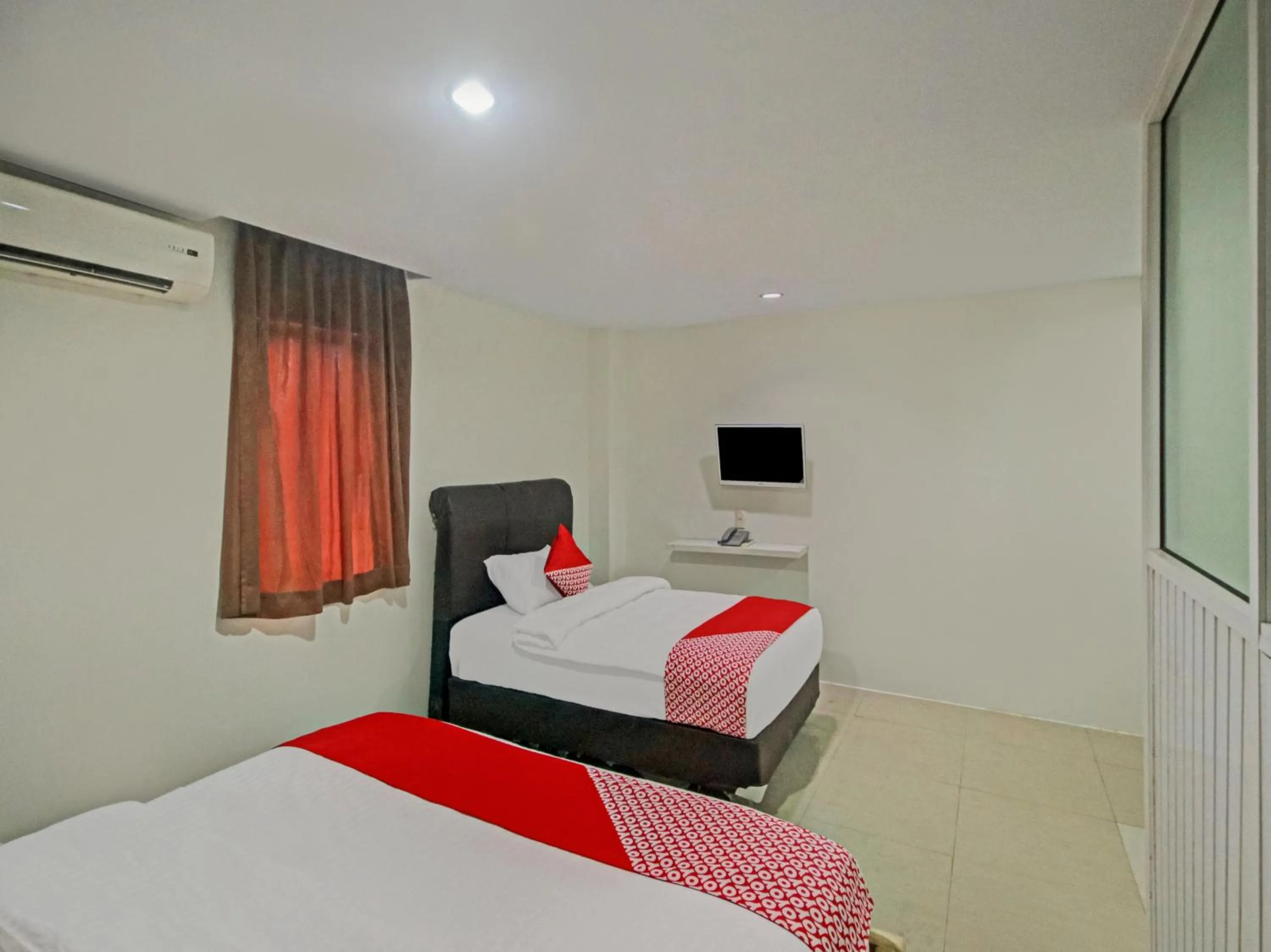 Bedroom in OYO 2574 Z Suites Hotel