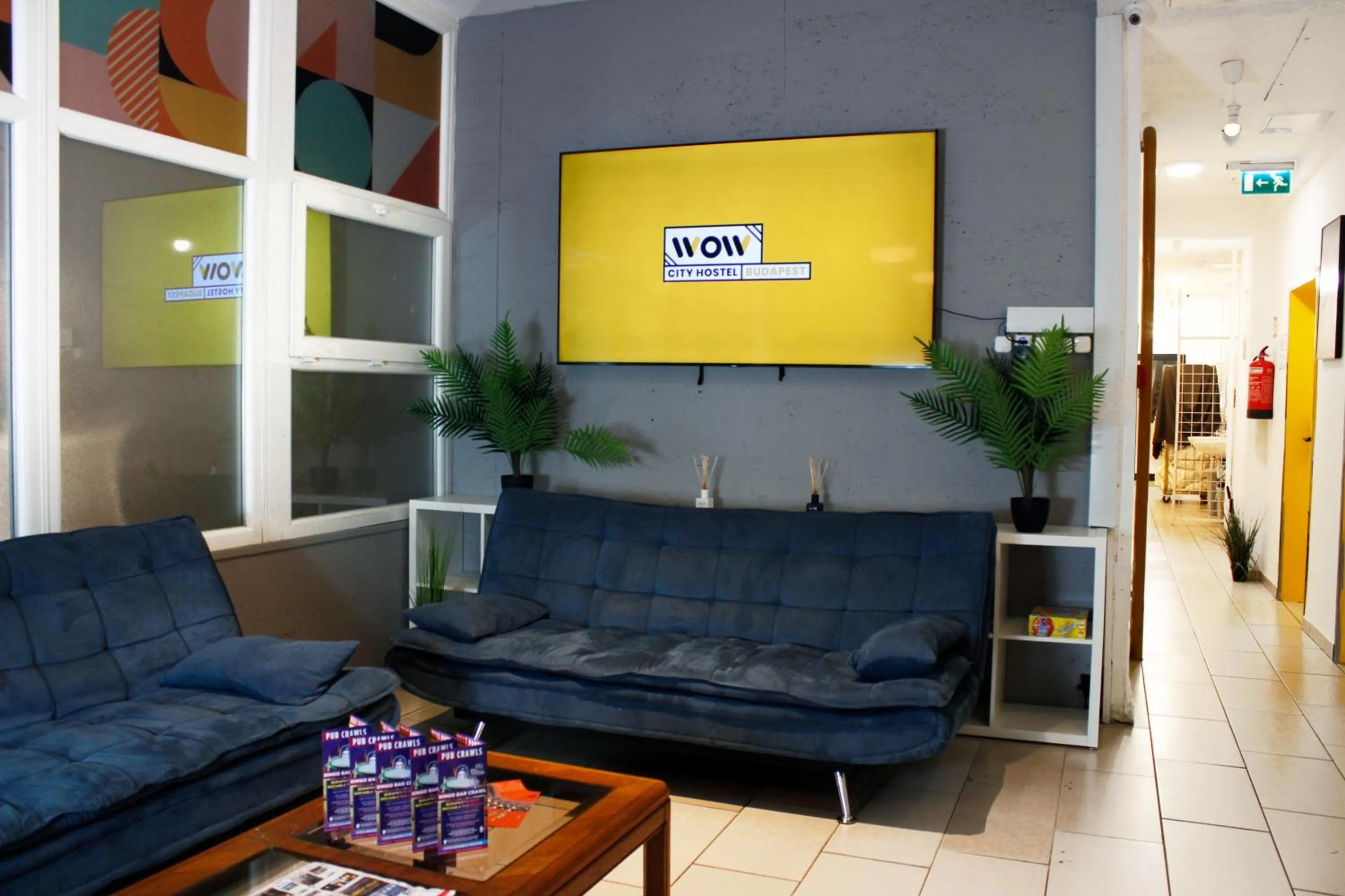 Communal lounge/ TV room in WOW City Hostel