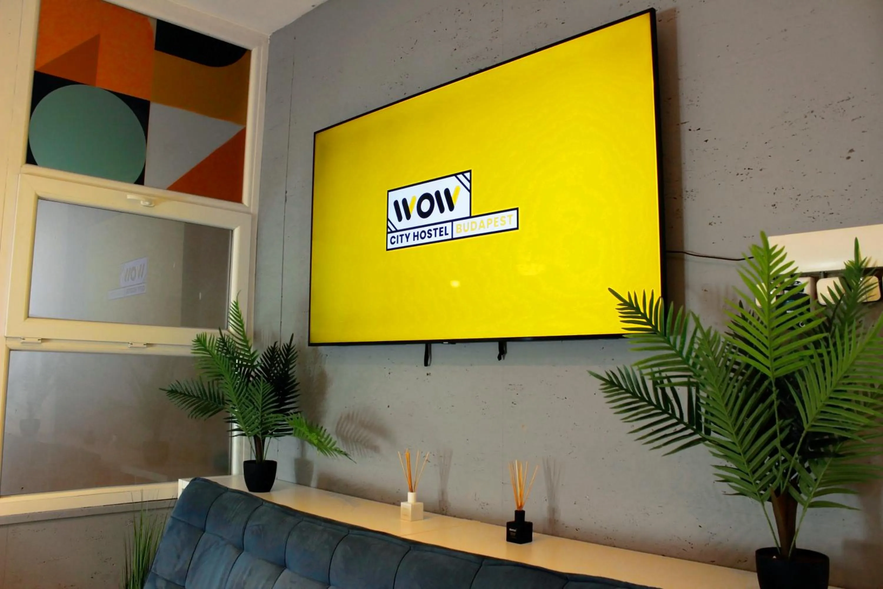 Communal lounge/ TV room in WOW City Hostel