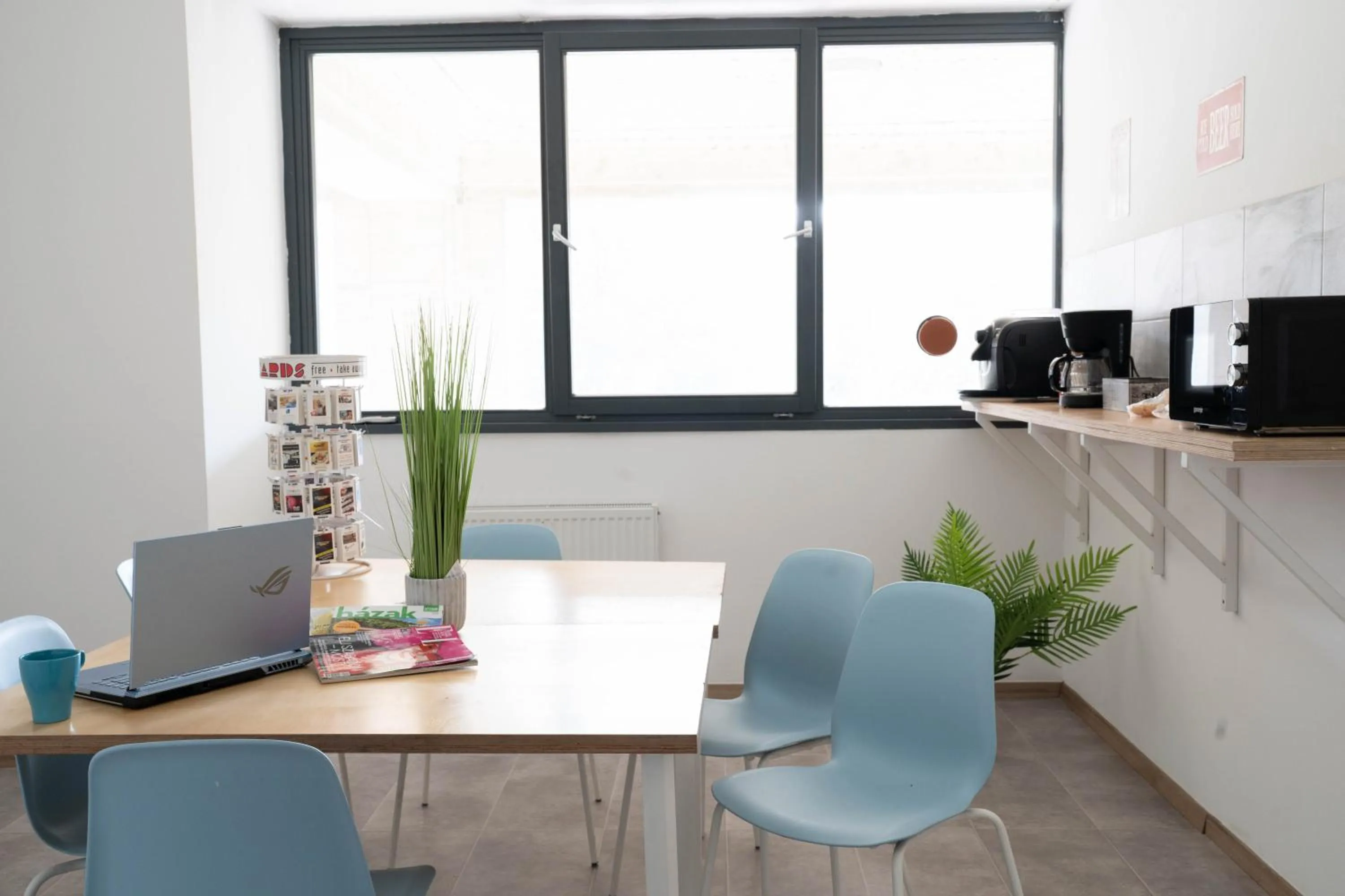 Communal lounge/ TV room in WOW City Hostel