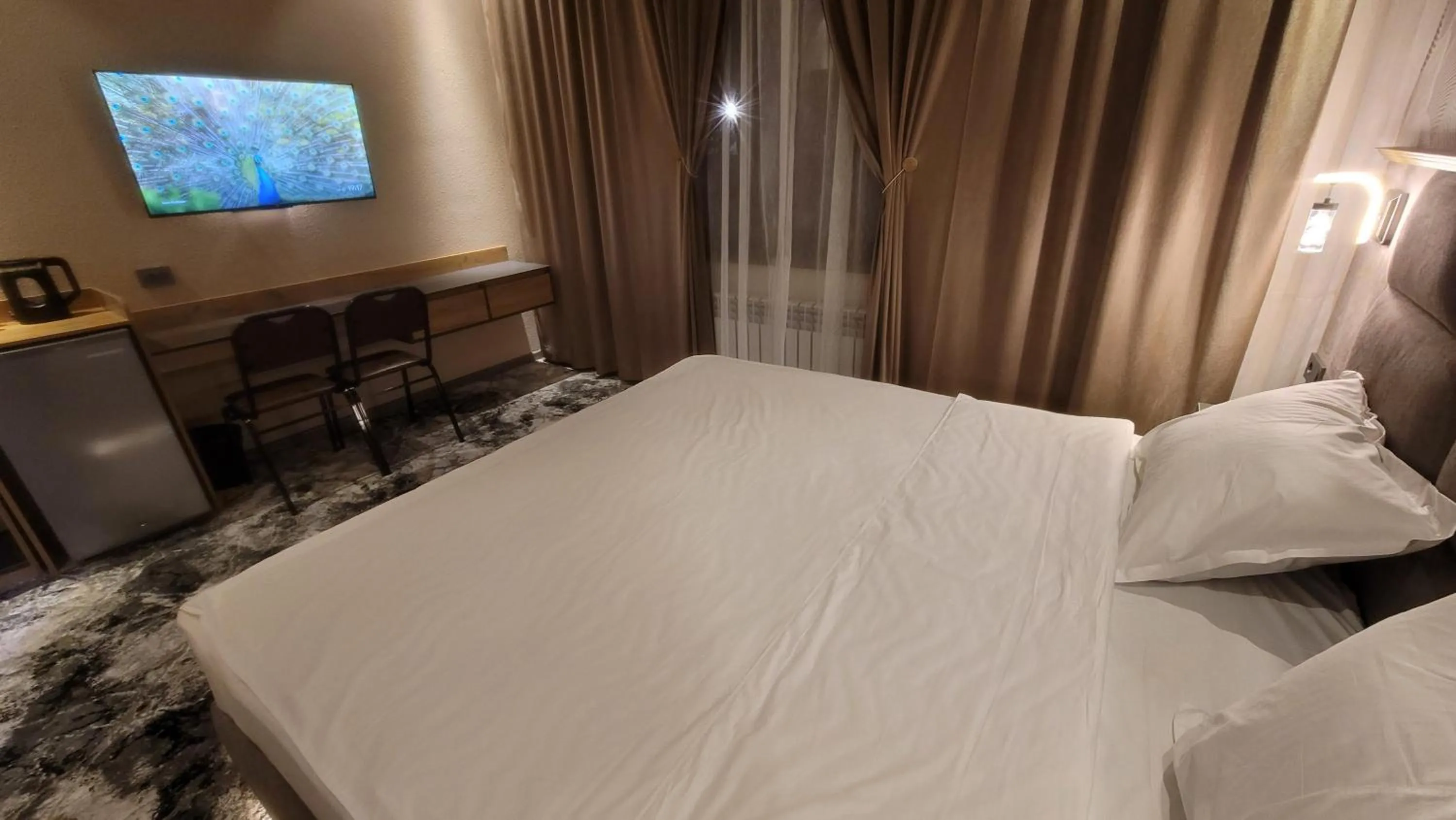 Bed in Homy House Hotel