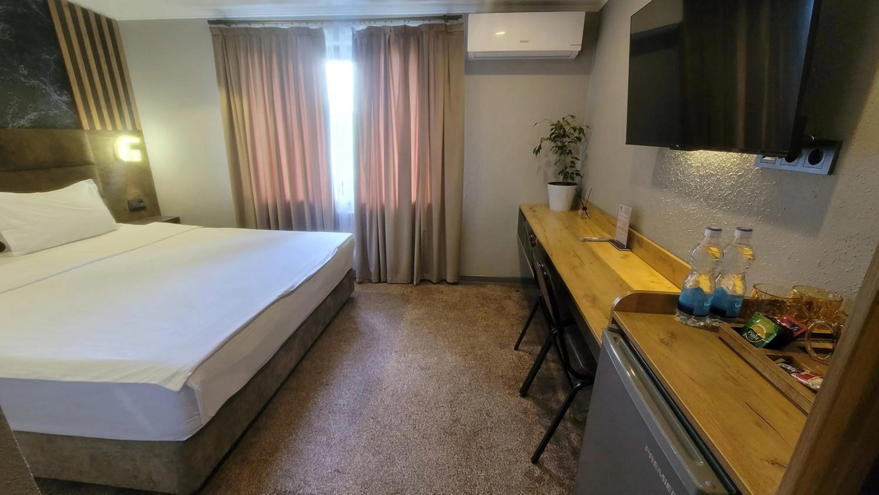 Bed in Homy House Hotel