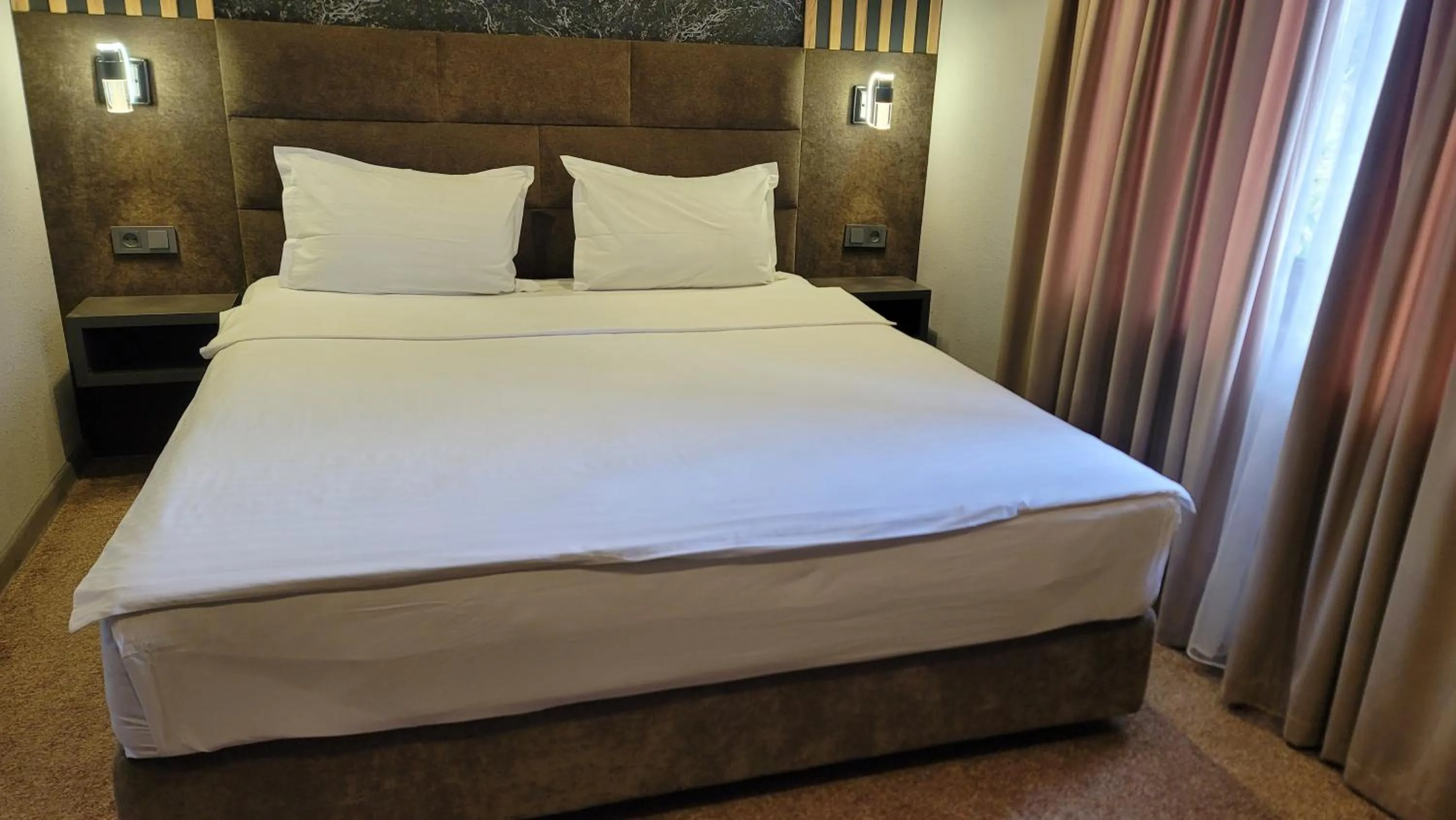 Bed in Homy House Hotel