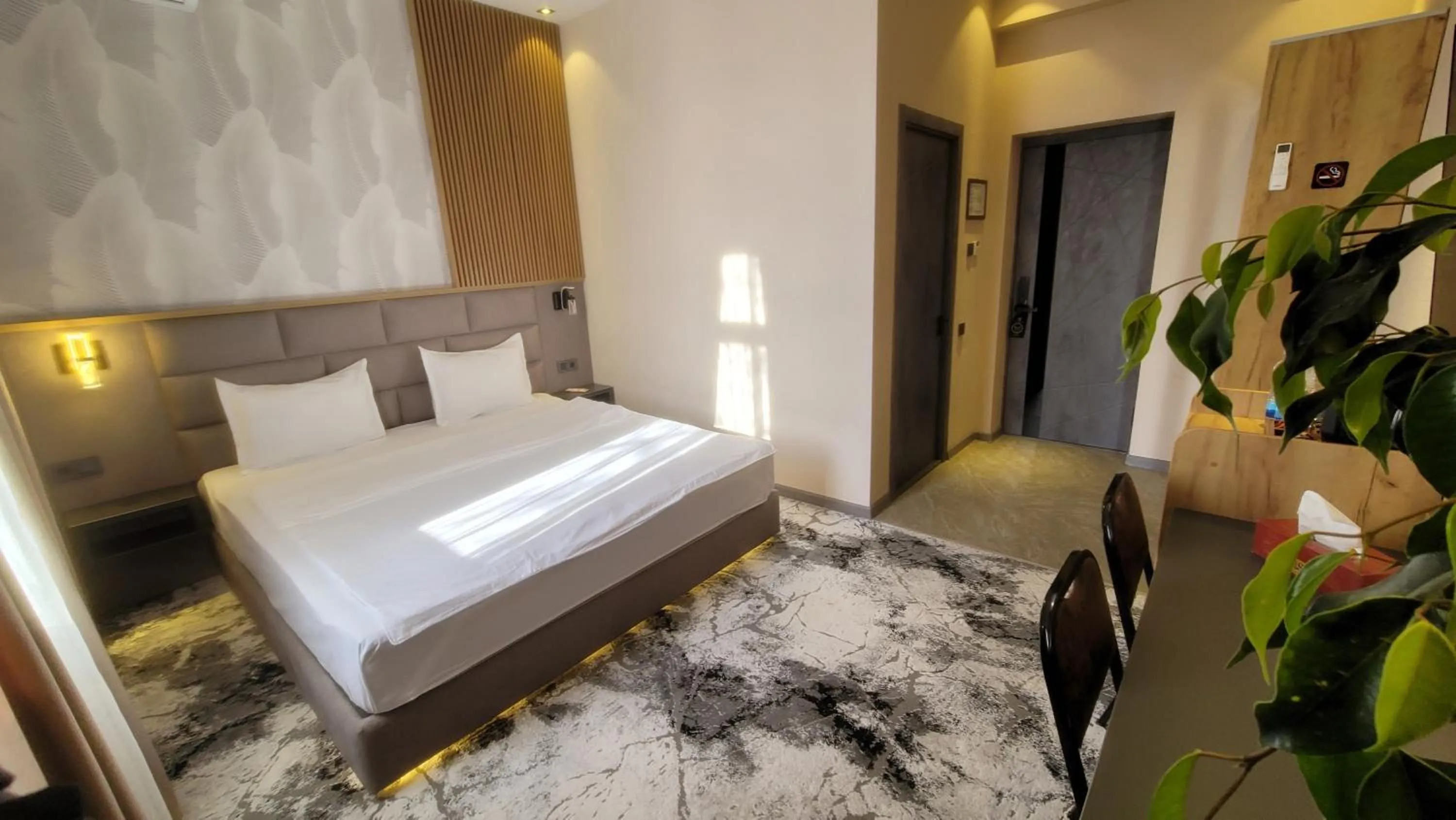 Bed in Homy House Hotel