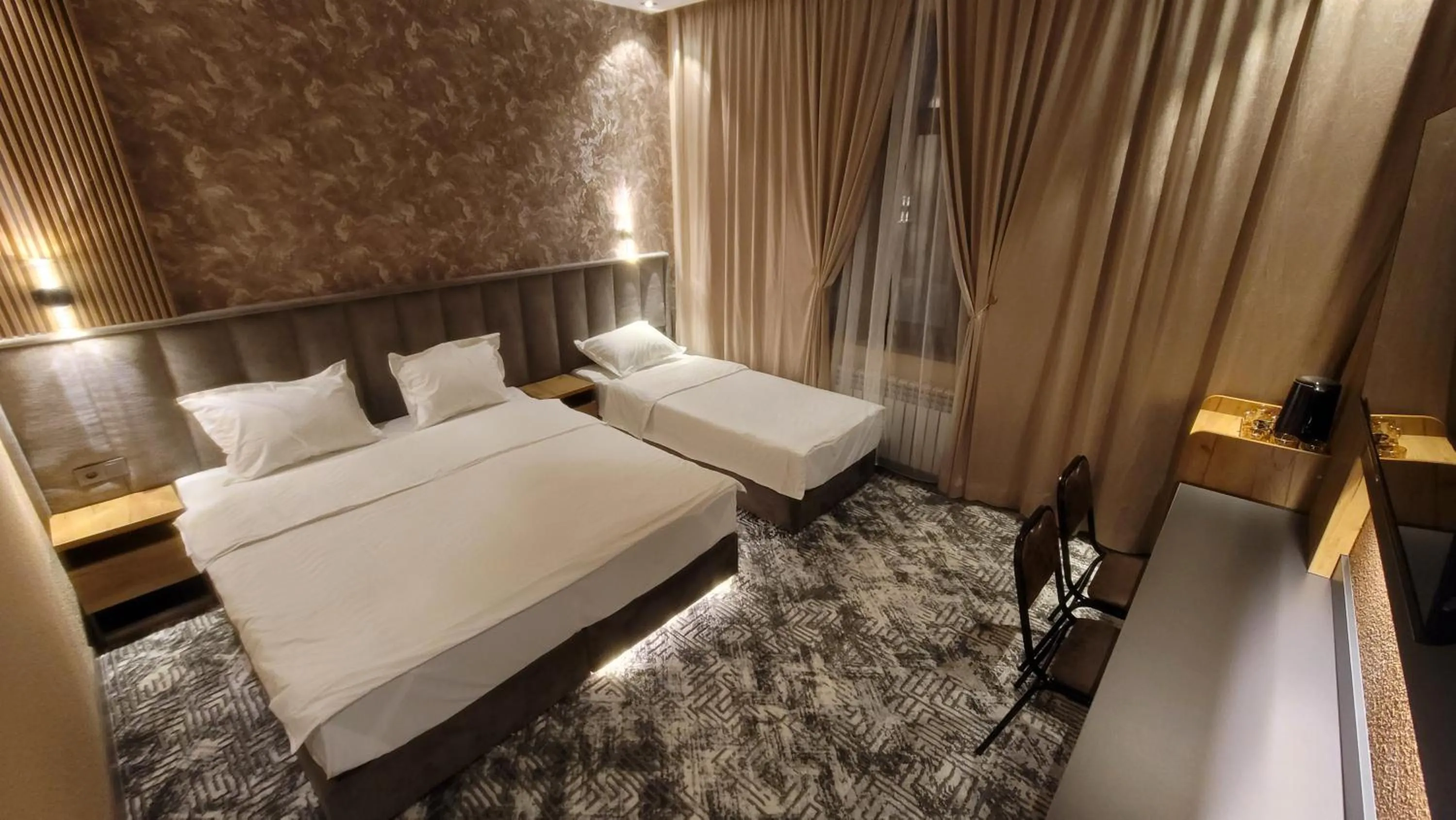 Bed in Homy House Hotel