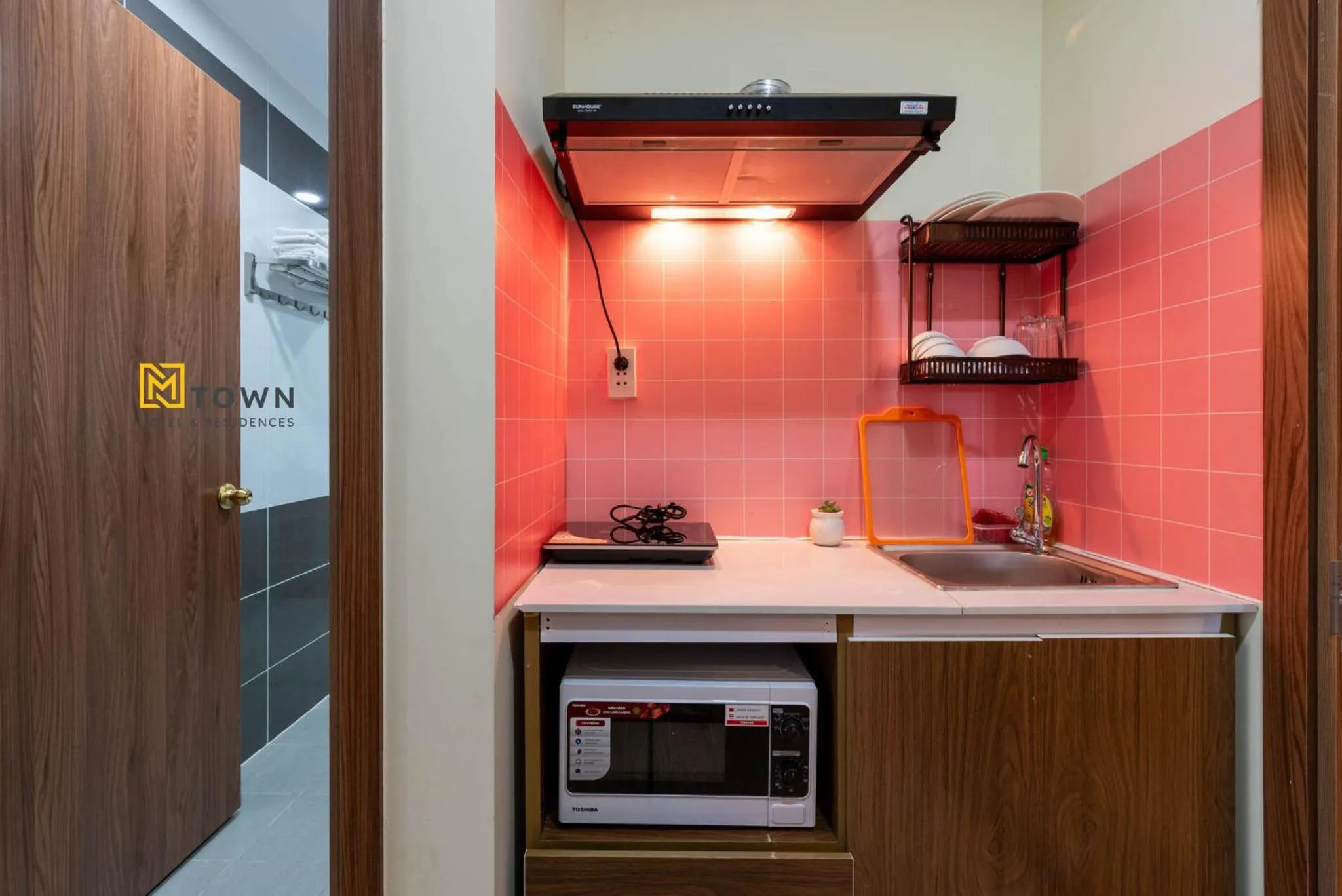 Kitchen or kitchenette in Luxy Park Hotel & Apartments - MTown