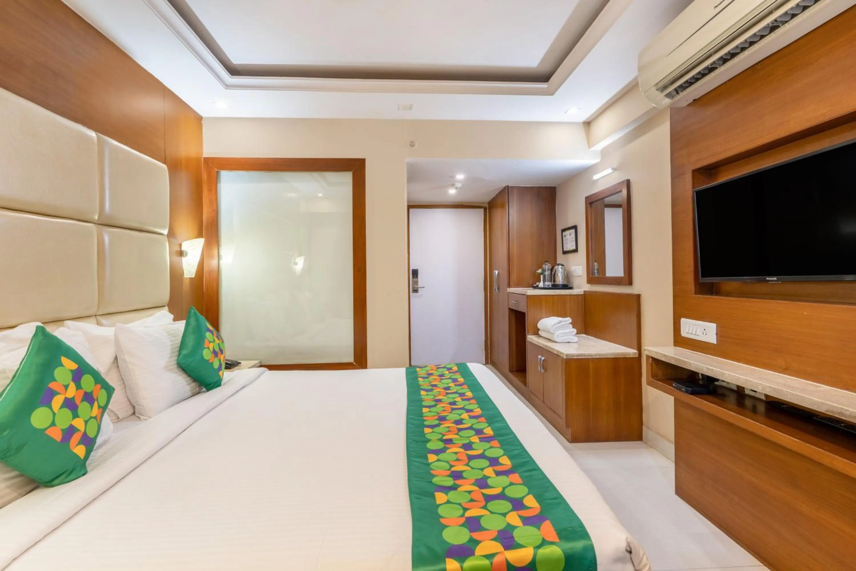 Bedroom, Bed in Treebo Premium Vinnie - Near Airport