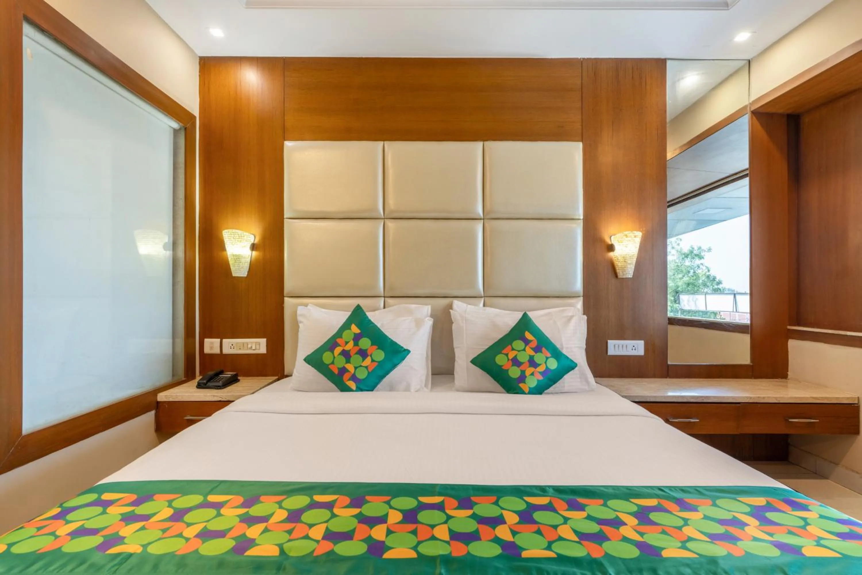 Bedroom, Bed in Treebo Premium Vinnie - Near Airport