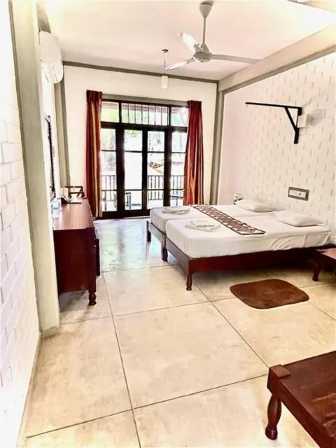 Bed in Serein Beach Hotel