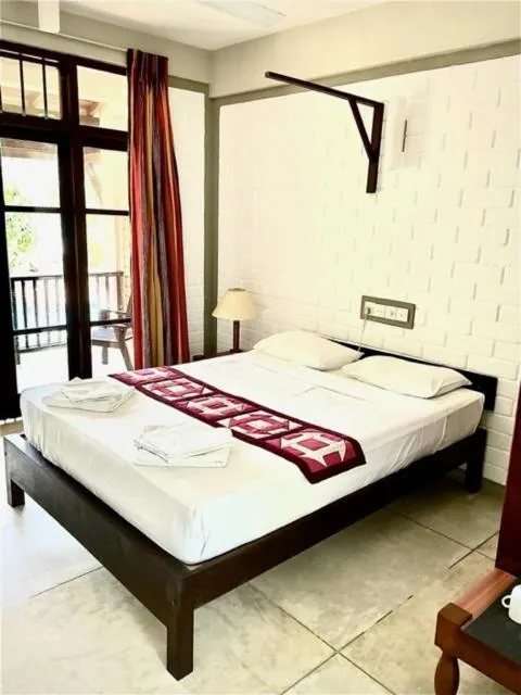 Bed in Serein Beach Hotel