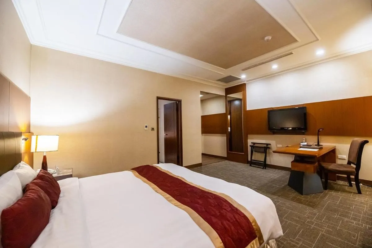 Photo of the whole room, Bed in Golden Tulip - Aesthetics