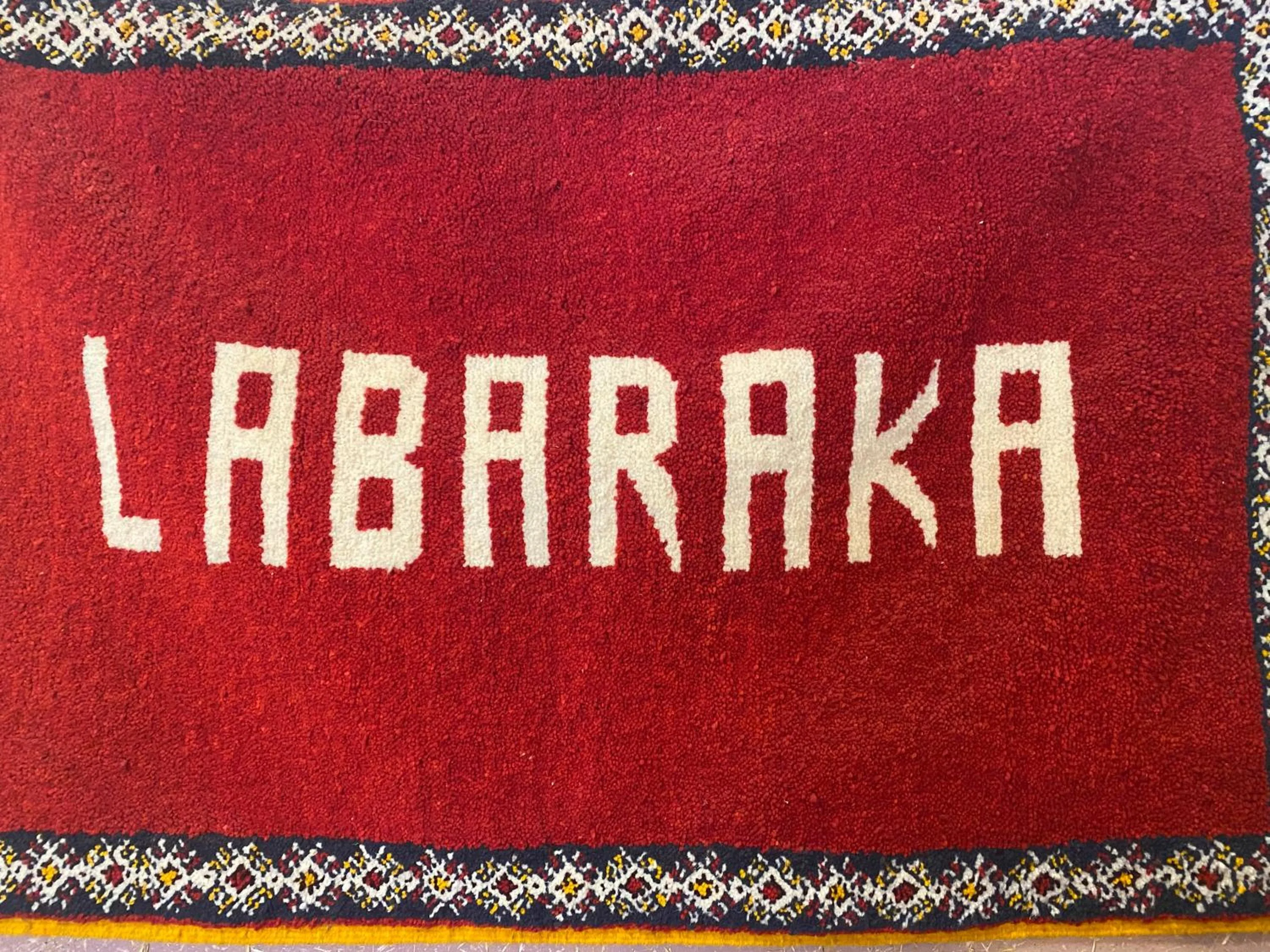 Property logo or sign in La Baraka Auberge