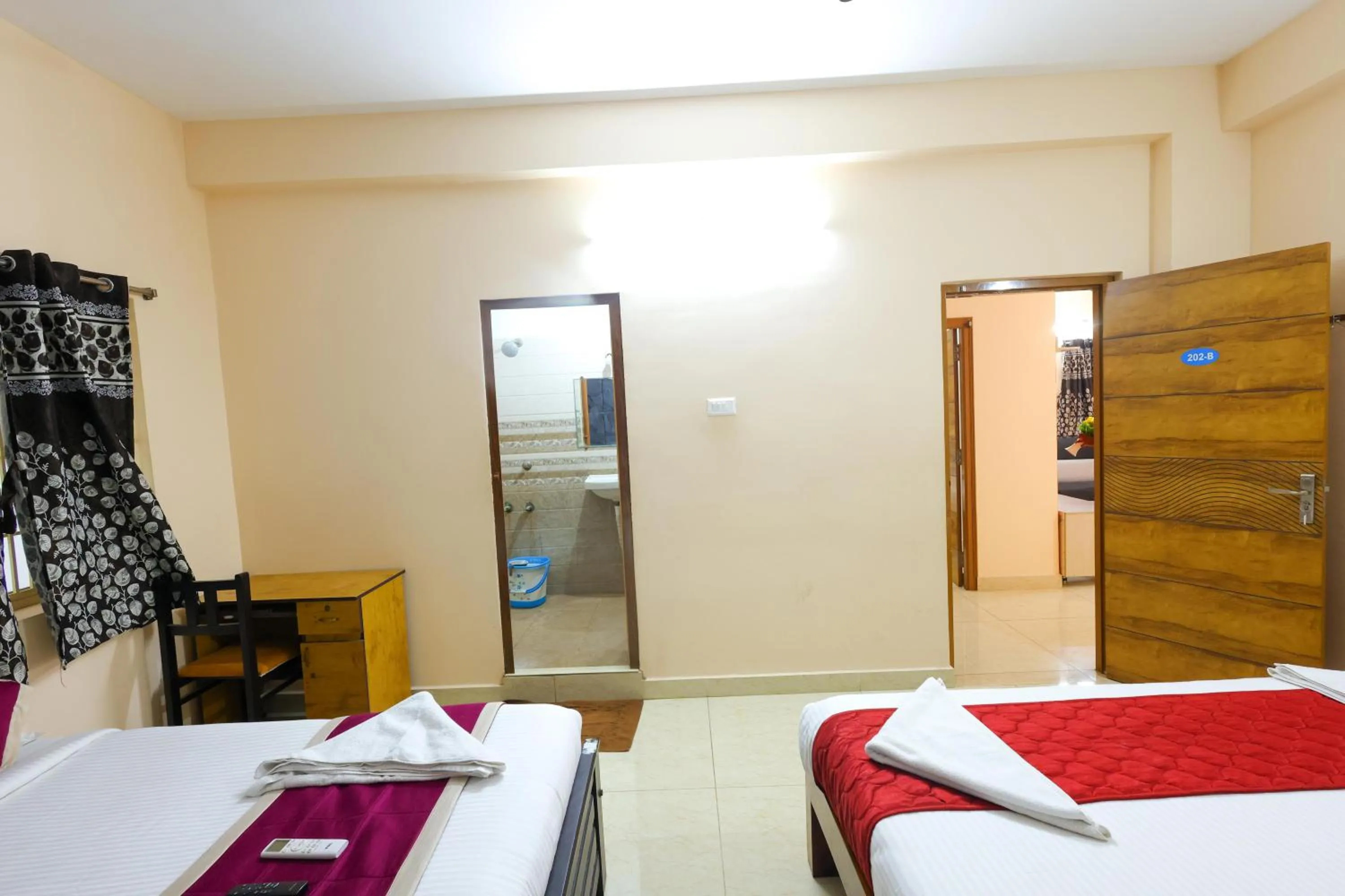 Photo of the whole room, Bed in SBHS Homestay - Garudadri - Tirupati Bus Stand