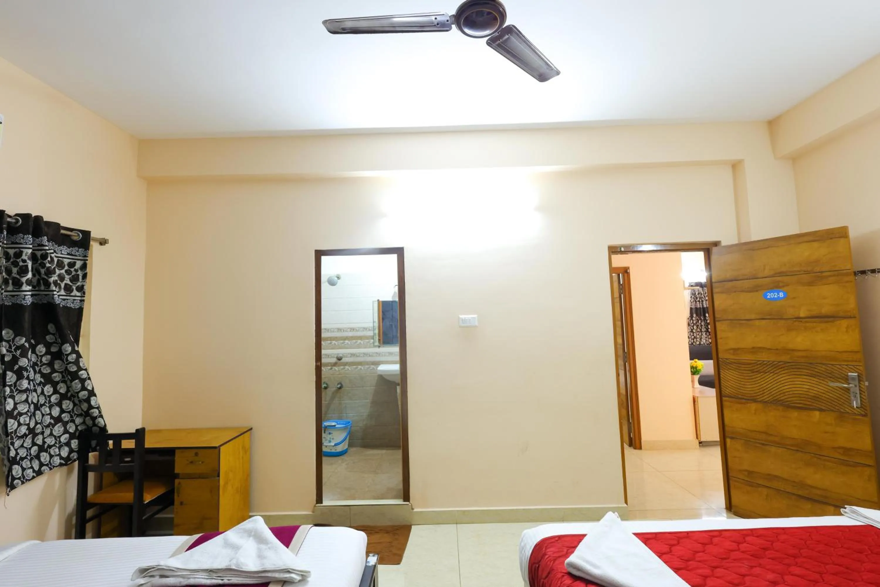 Photo of the whole room, Bed in SBHS Homestay - Garudadri - Tirupati Bus Stand