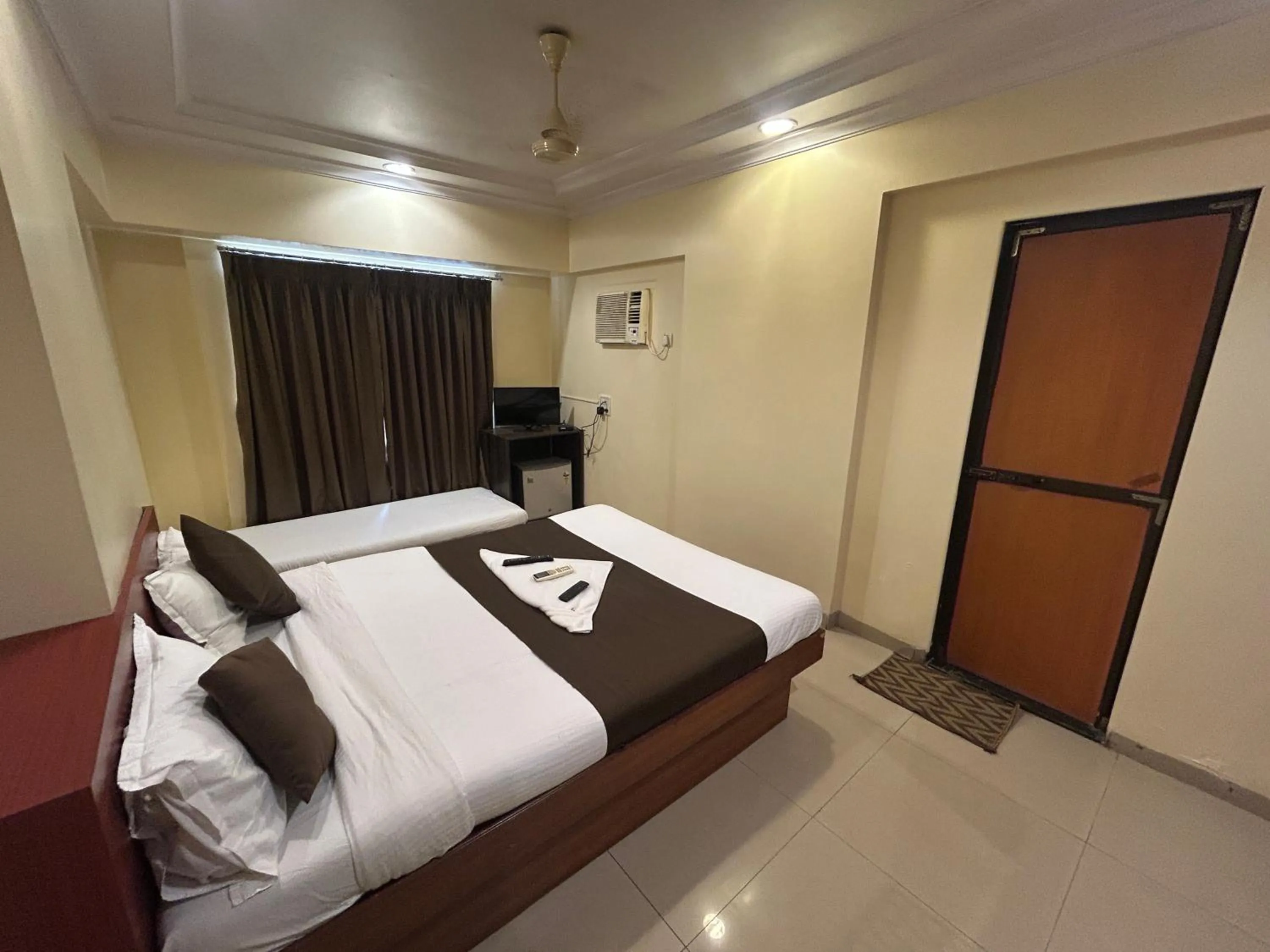 Photo of the whole room, Bed in Hotel Lucky Goregaon