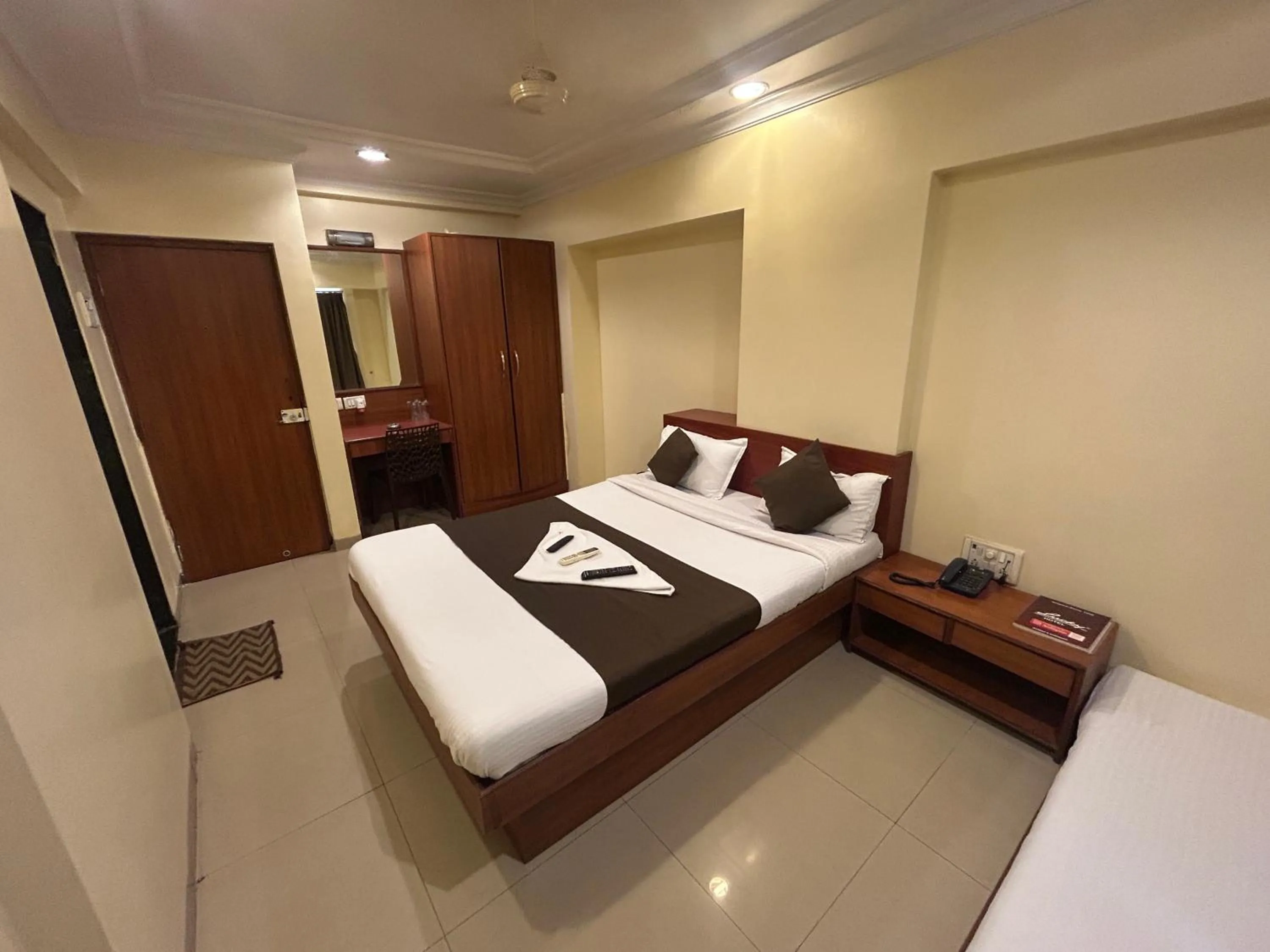 Photo of the whole room, Bed in Hotel Lucky Goregaon