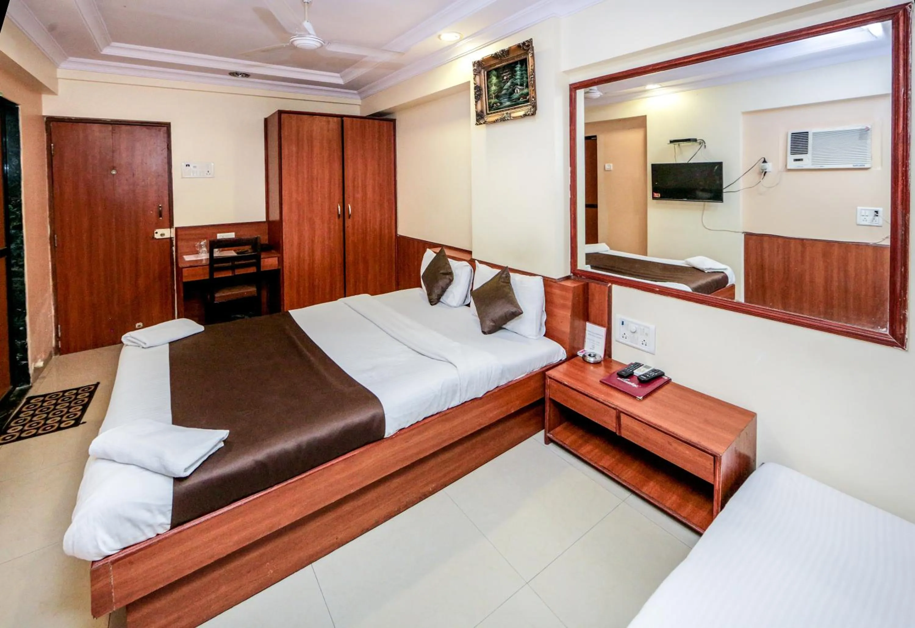 Photo of the whole room, Bed in Hotel Lucky Goregaon