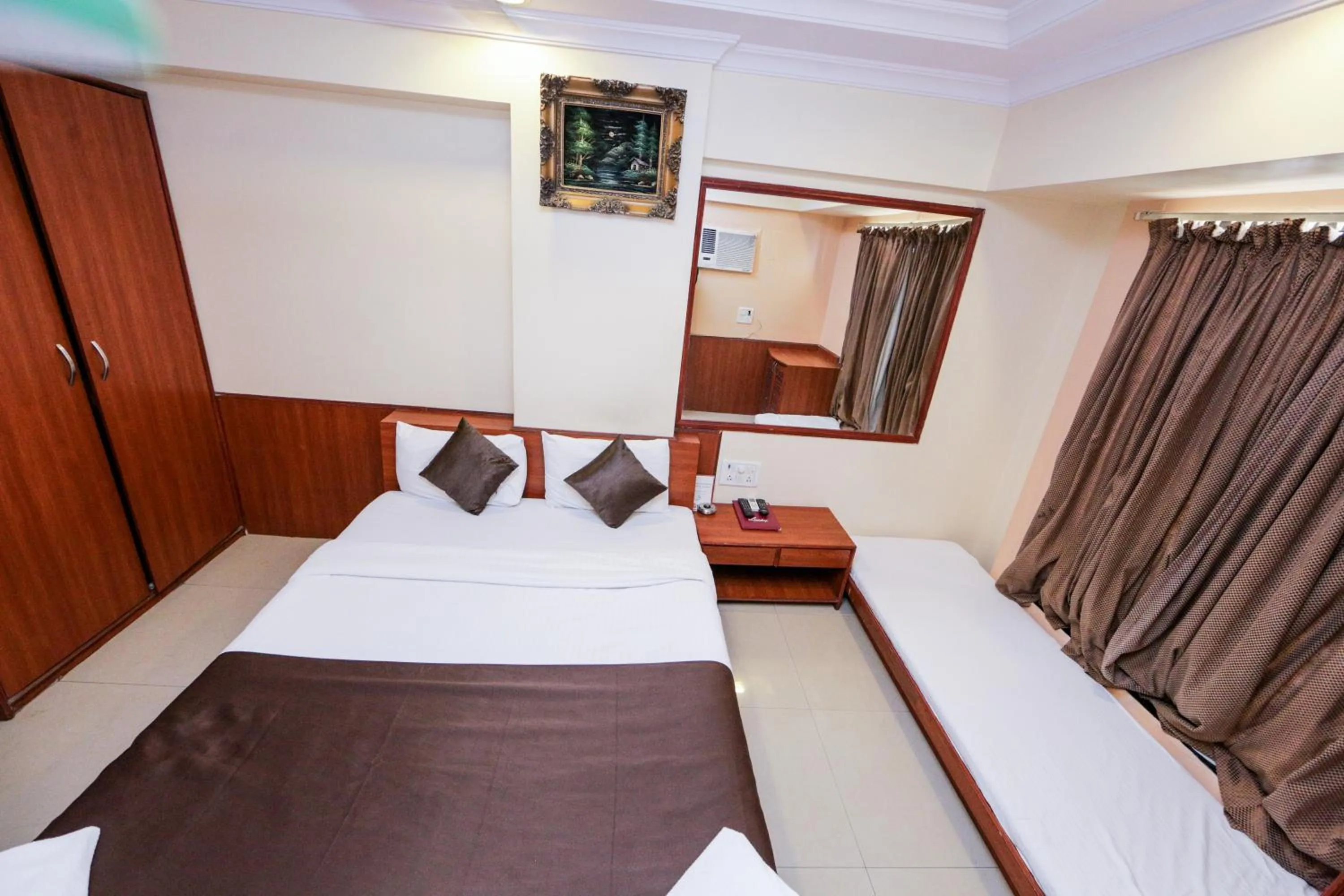 Photo of the whole room, Bed in Hotel Lucky Goregaon