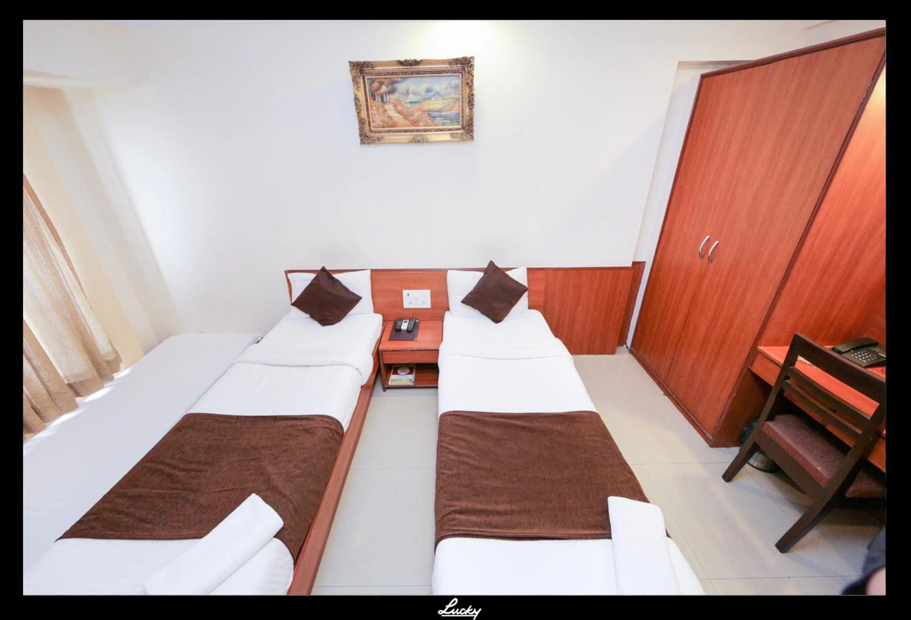 Photo of the whole room, Bed in Hotel Lucky Goregaon