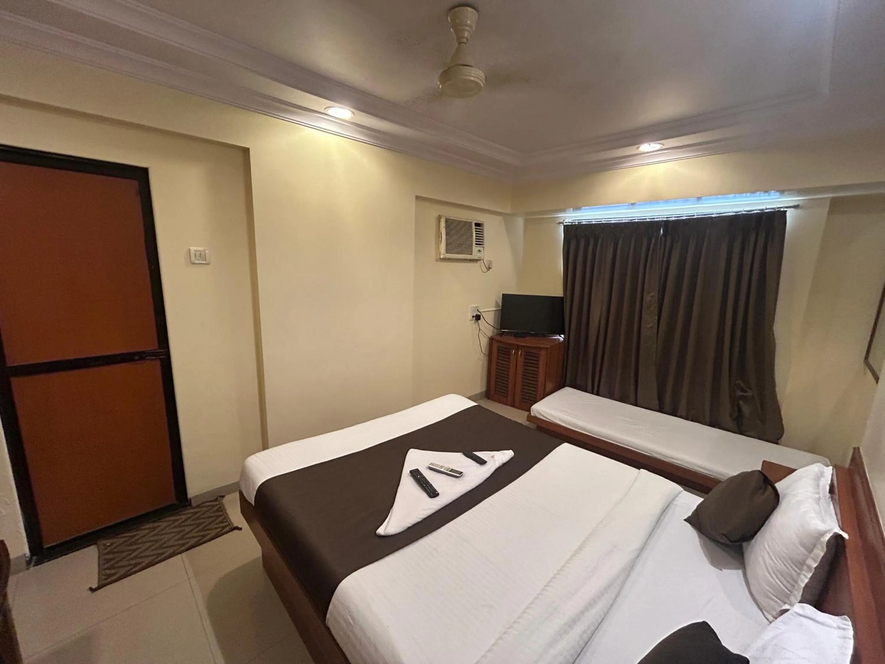 Photo of the whole room, Bed in Hotel Lucky Goregaon