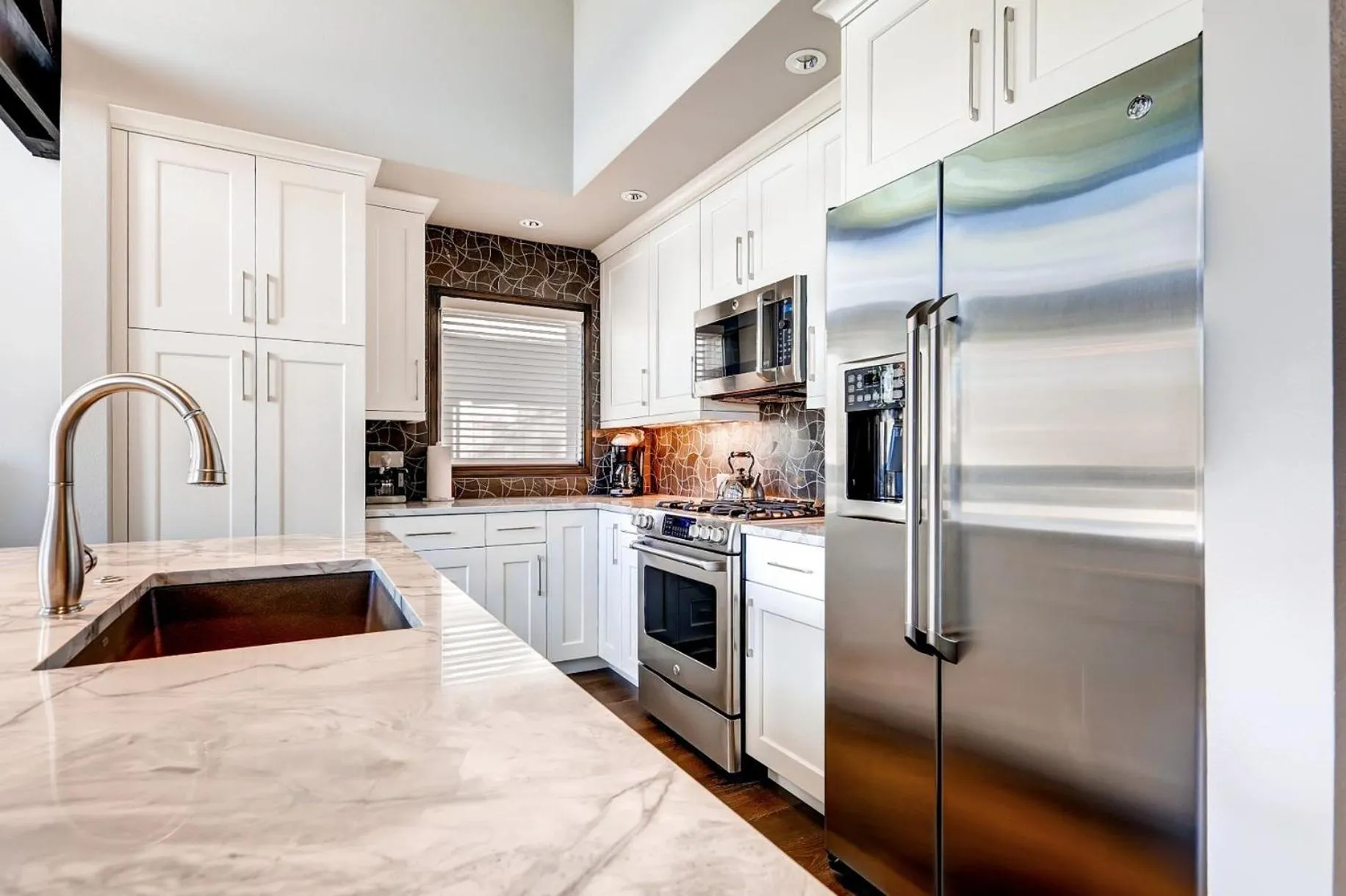 Communal kitchen in The Pines Lodge, a RockResort, by Vail Resorts