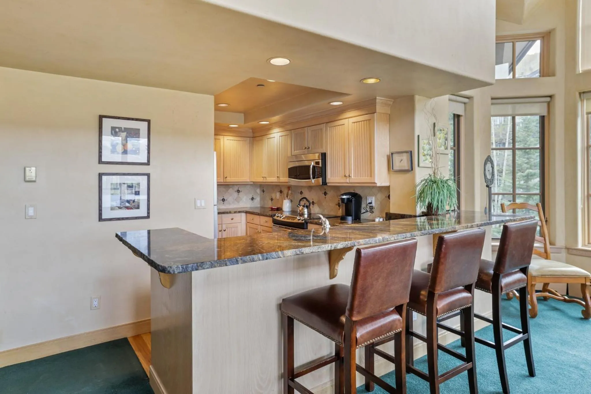 Communal kitchen in The Pines Lodge, a RockResort, by Vail Resorts