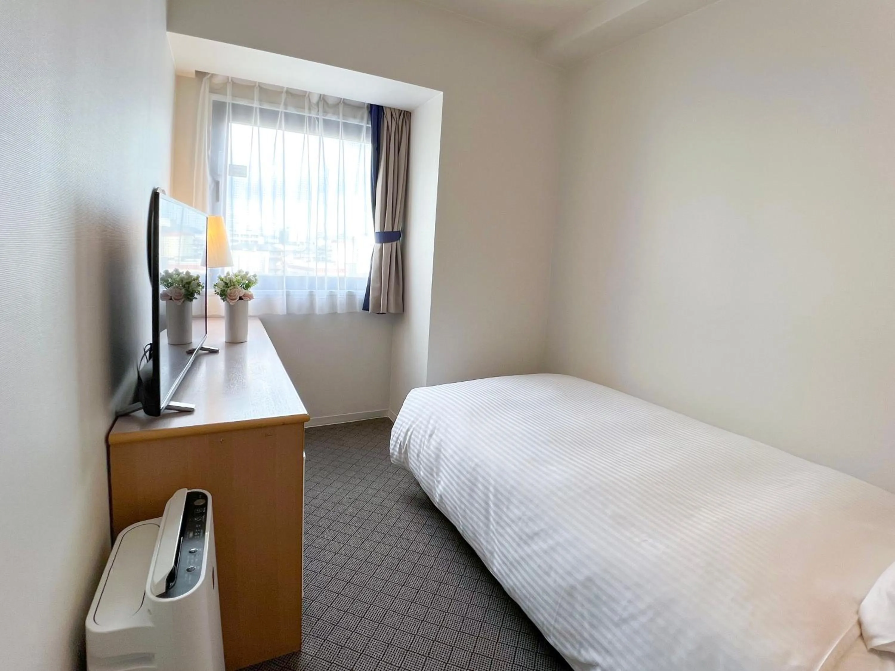 Bed in Grand Park Hotel Panex Kimitsu