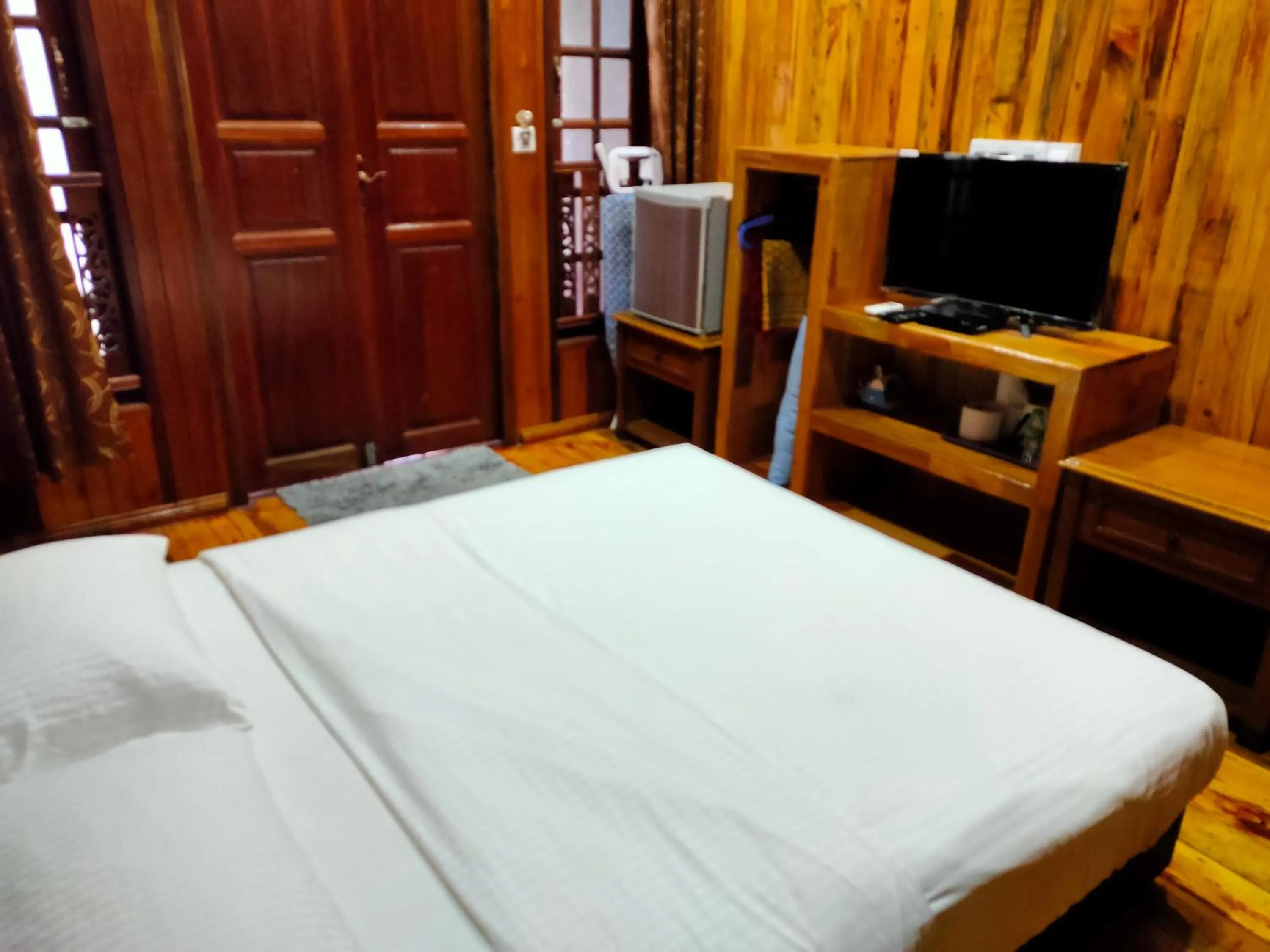 Photo of the whole room, TV/Entertainment Center in KEMBARA RESORT