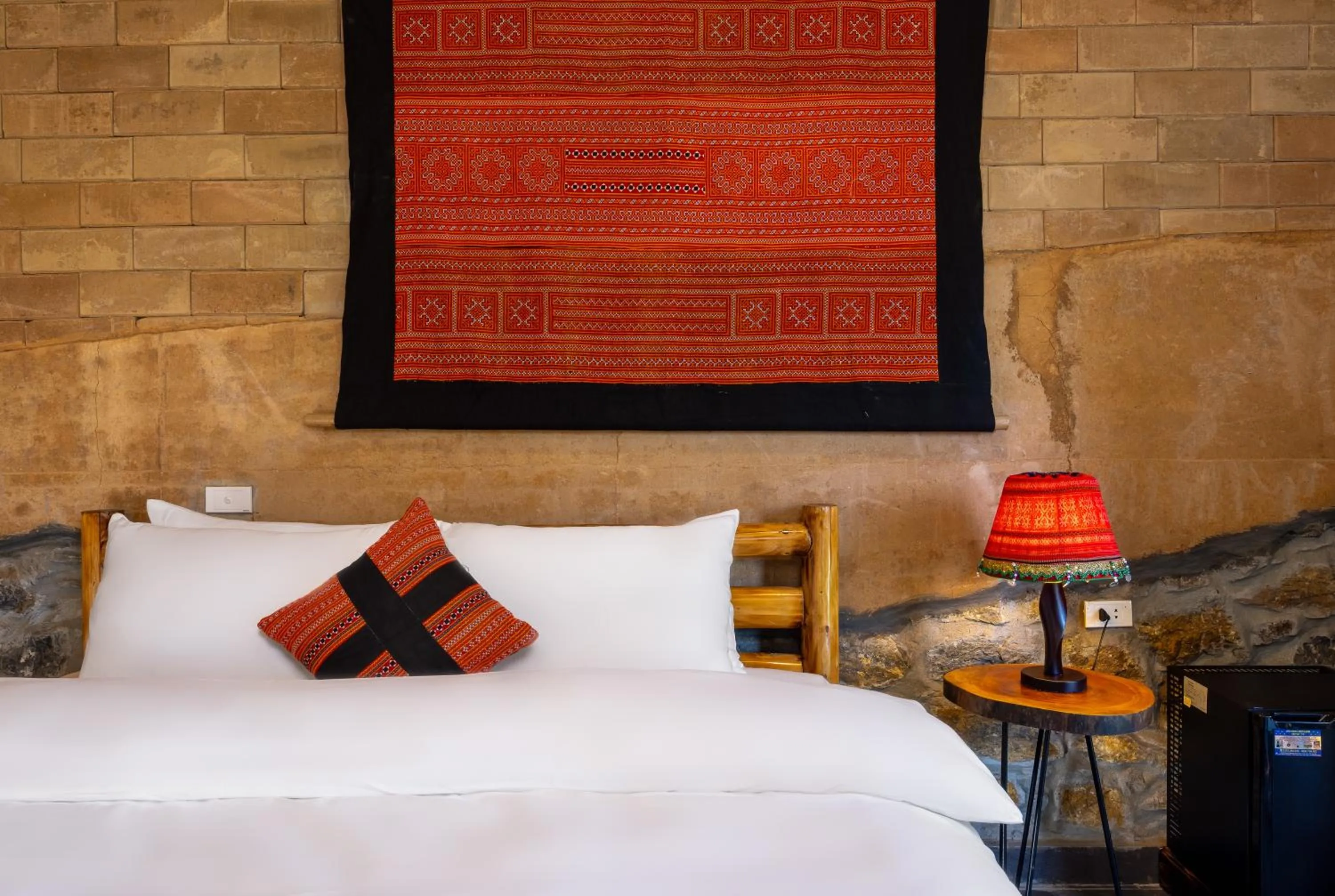 Bed in Sapaxa Spring Garden Ecolodge