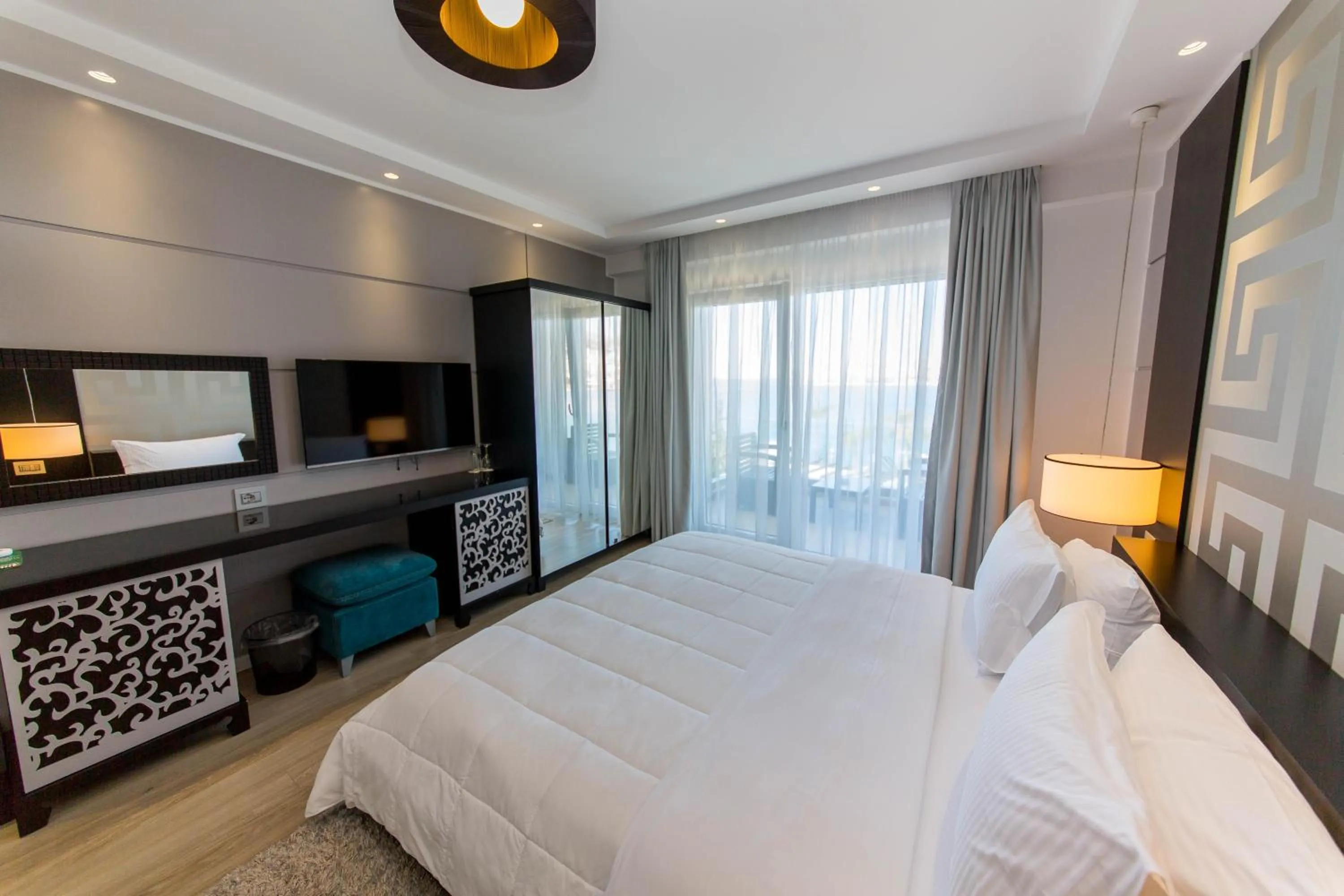 Communal lounge/ TV room, Bed in Demi Hotel