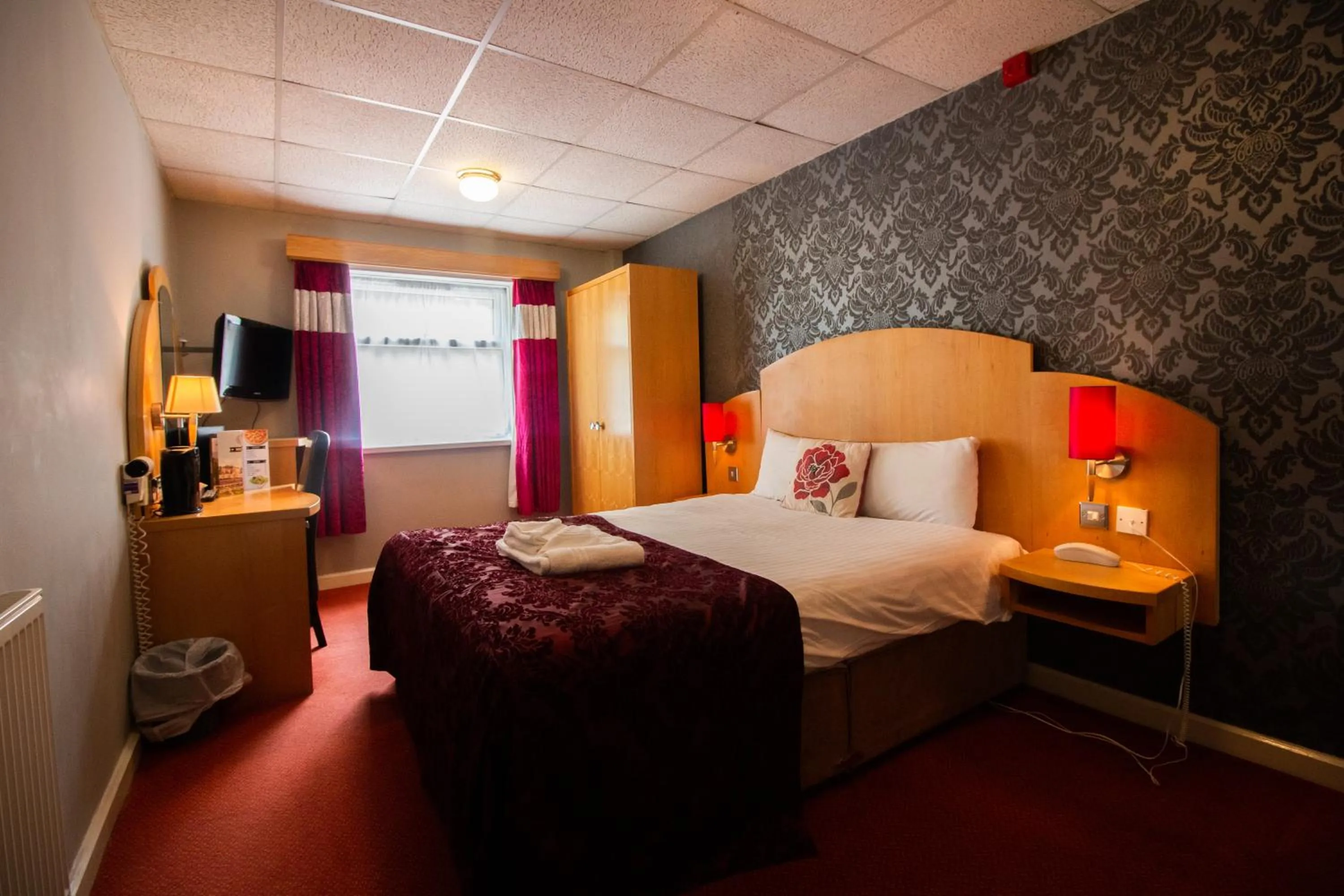 Bed in Westone Manor Hotel