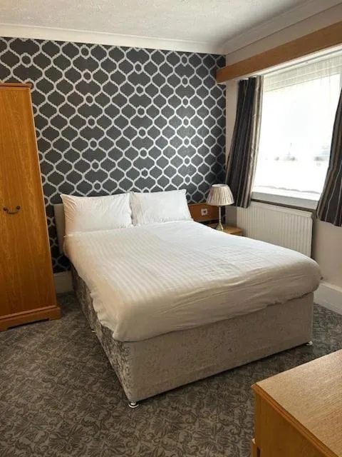 Bed in Westone Manor Hotel