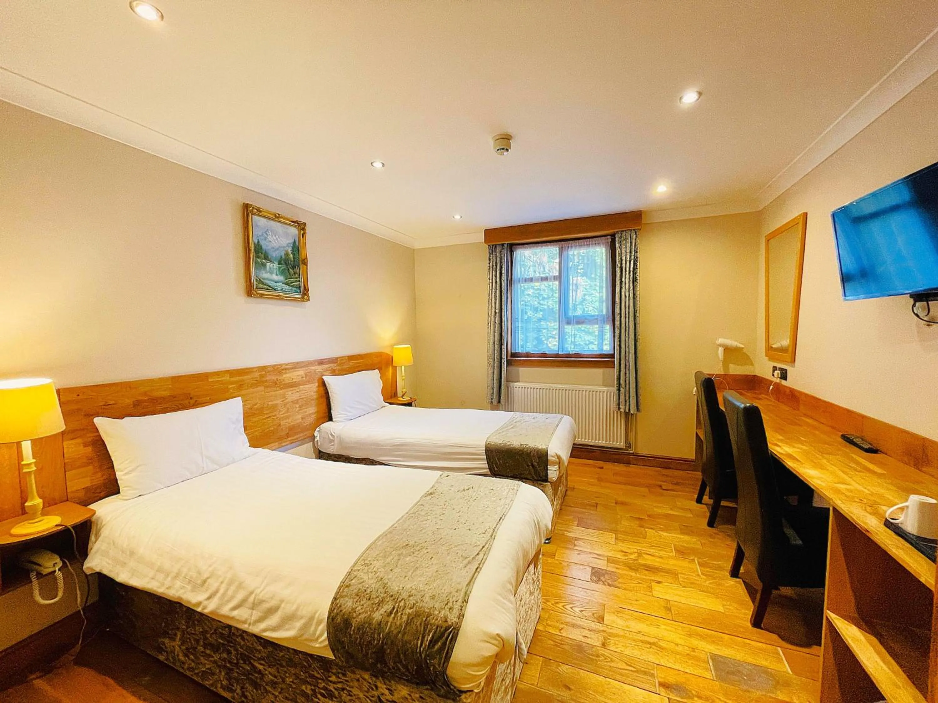 Bed in Westone Manor Hotel