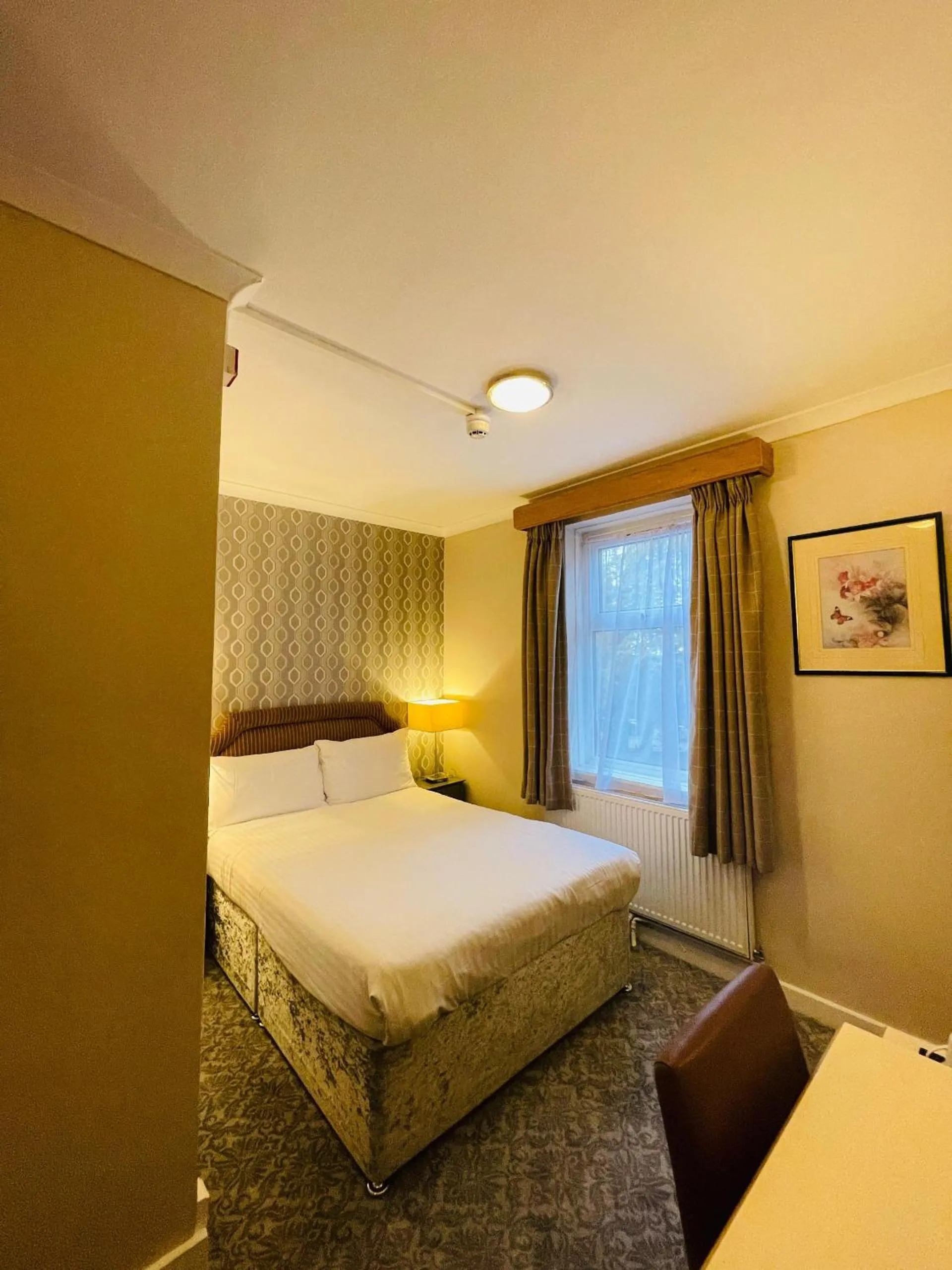 Bed in Westone Manor Hotel