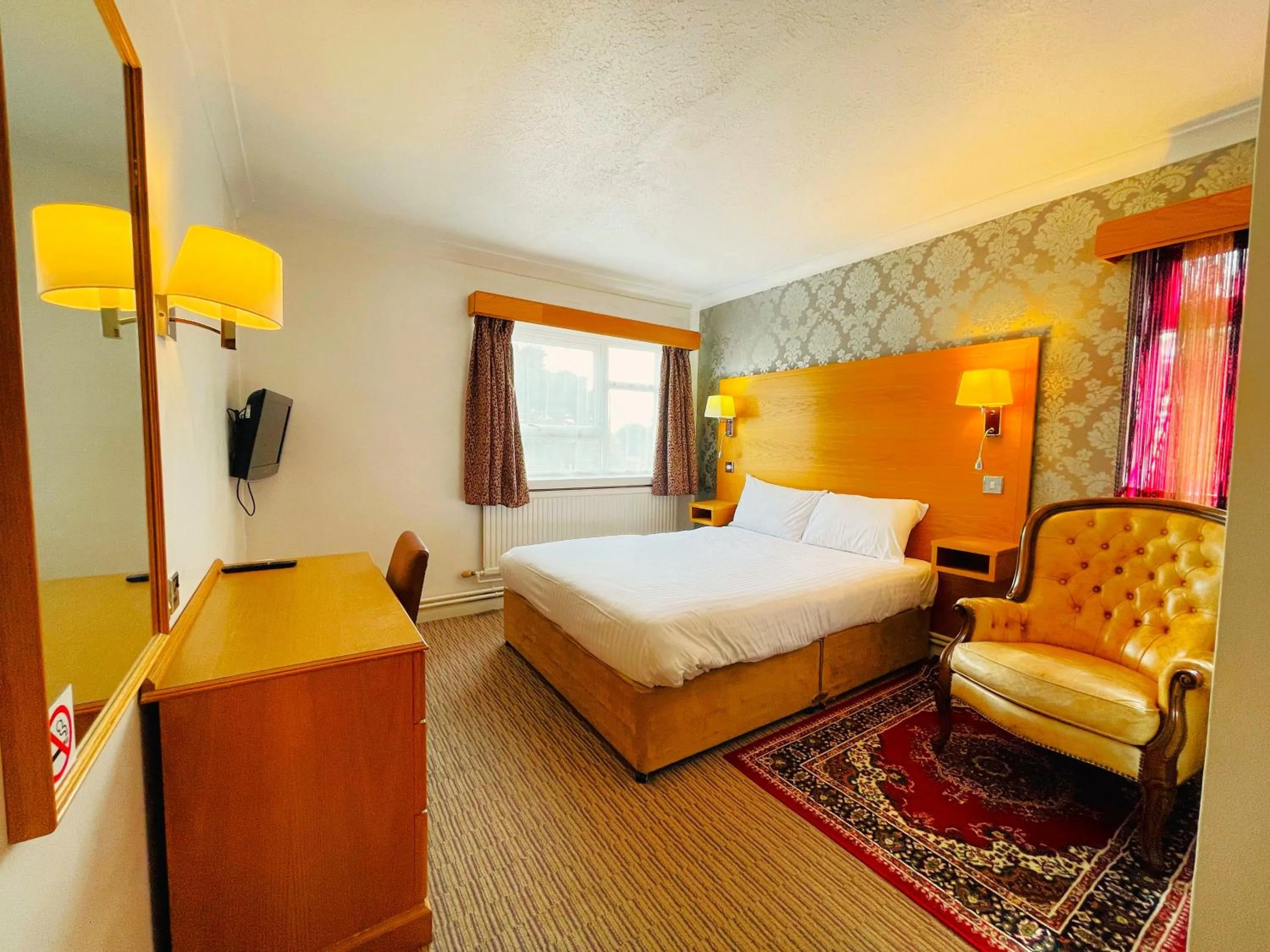 Bed in Westone Manor Hotel