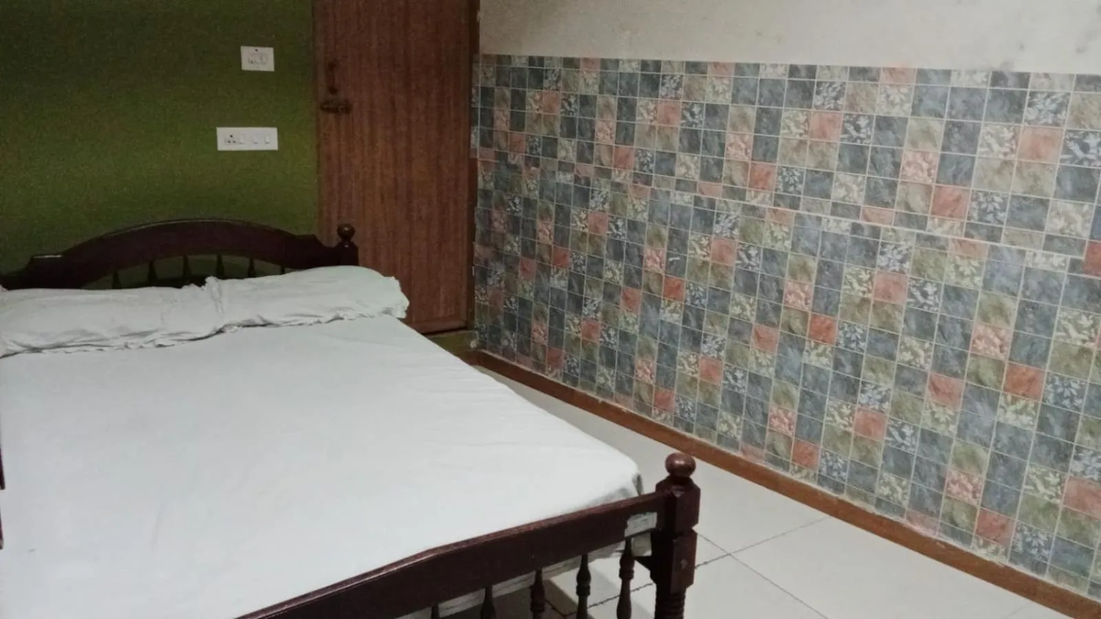 Bed in JAYA BHARATHI LODGE