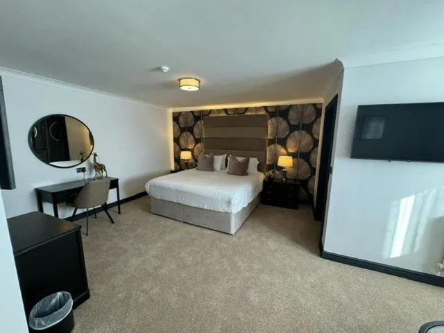 Bed in The Diplomat Hotel Restaurant & Spa